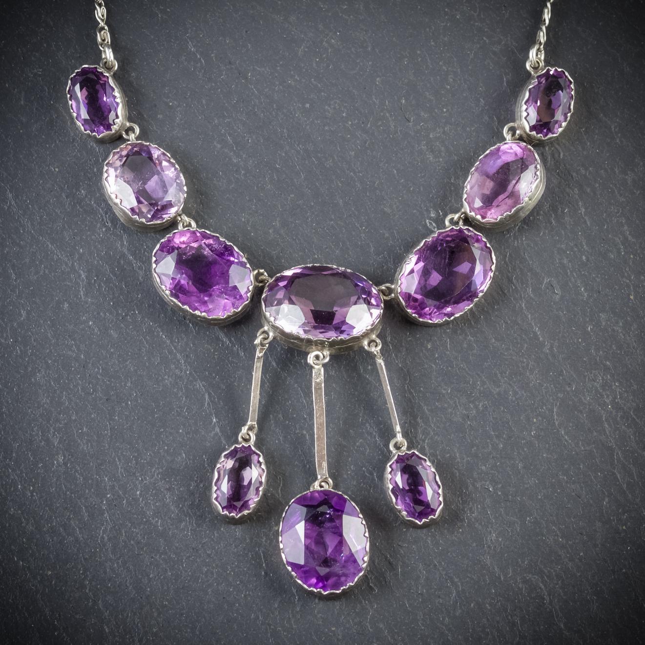 A magnificent antique Amethyst necklace from the Victorian era, Circa 1900

The necklace is set in Silver and displays beautiful violet Amethyst’s with three fabulous Amethyst droppers dangling below

There are 40ct of Amethyst across the piece,