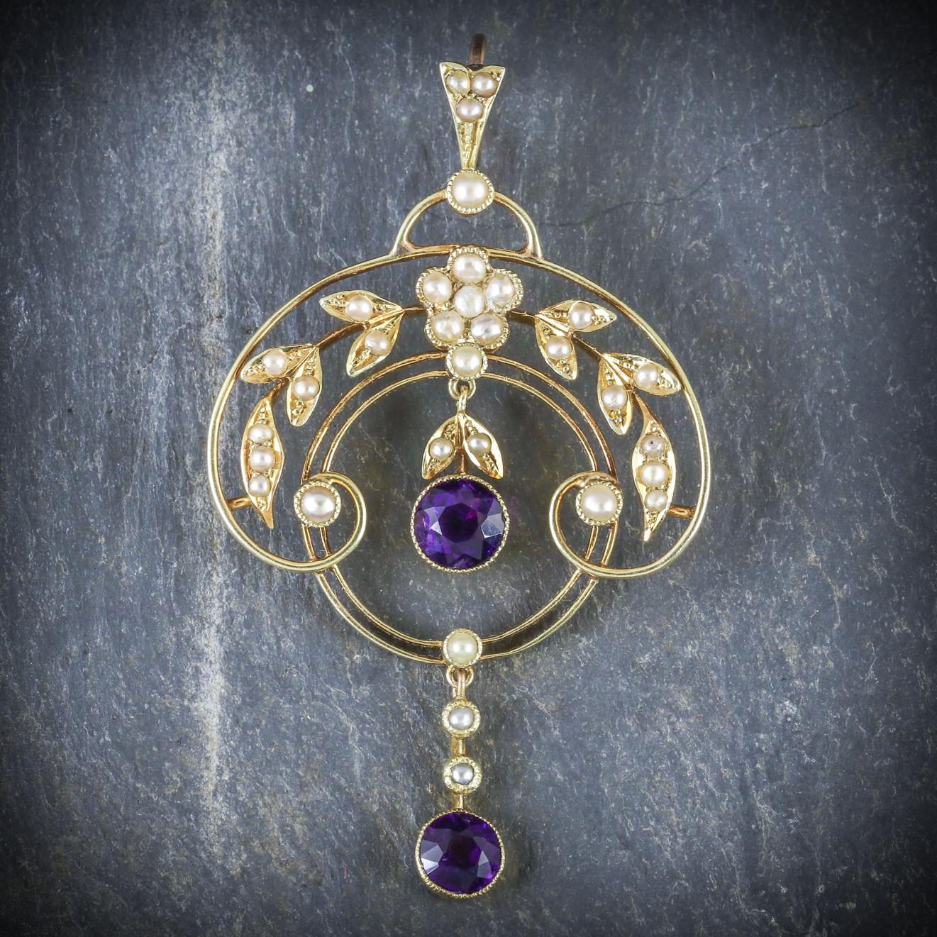 This wonderful antique Victorian pendant is decorated in lovely Pearls and two fabulous Amethyst droppers in a beautiful floral gallery

The central Amethyst is 1ct with a 0.75ct Amethyst dangling below

Beautifully made in 15ct Yellow Gold which is