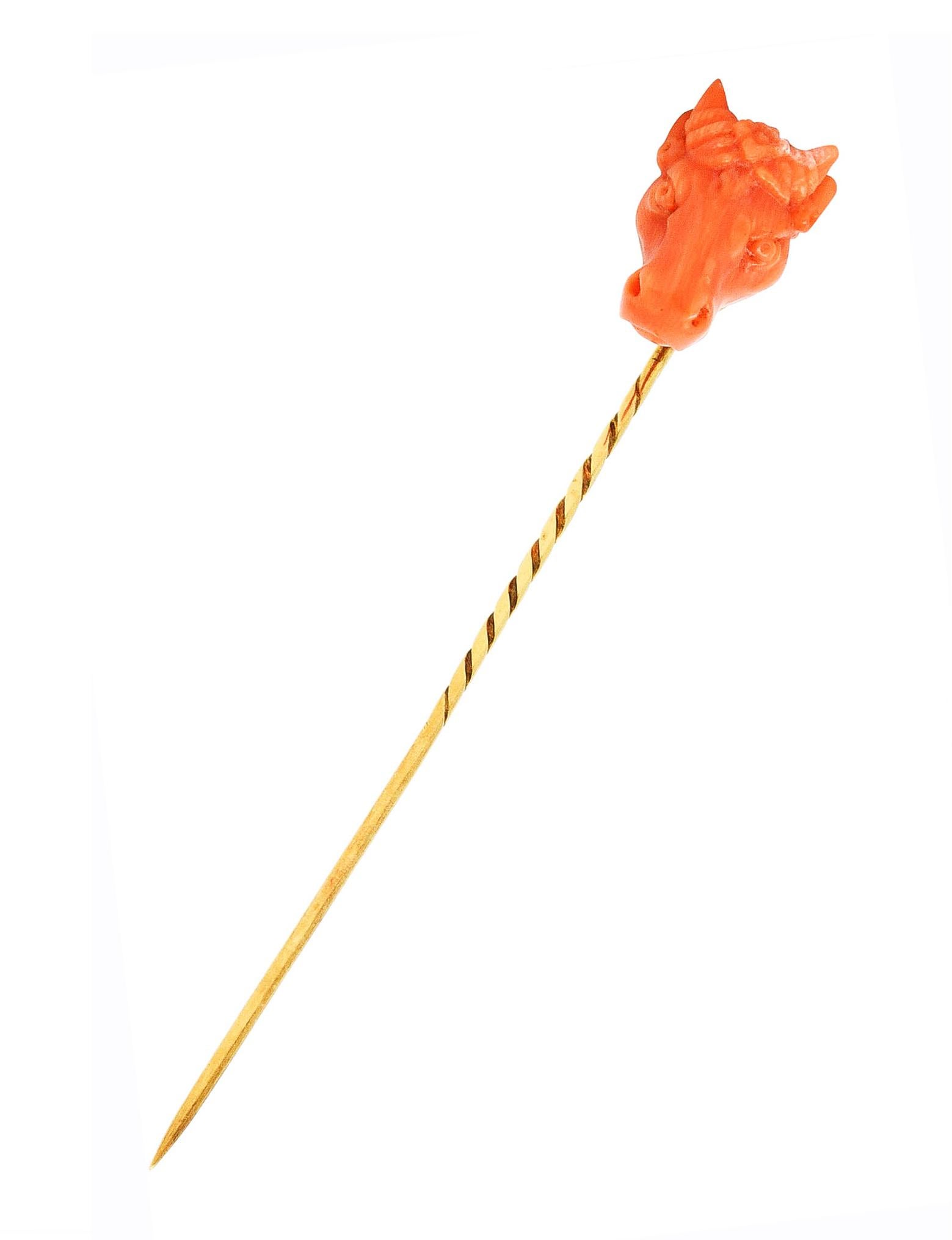 Stickpin features coral carved to depict the head of a bull with flower crown

Opaque reddish orange in color with medium saturation

Symbolizing the Greek god Zeus in the myth of Europa

Completed by swirled pinstem

Tested as 14 karat gold

Circa: