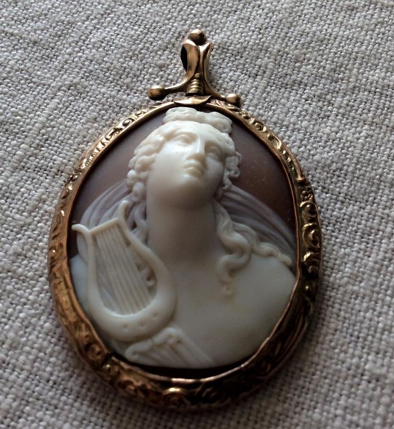 Excellent Quality Victorian shell Cameo pendant depicting the God Apollo, portrayed in front face. Front face cameos are rare and hard to find, and especially an artwork like this one.  This is a cameo of surpassing beauty an incredible work of art