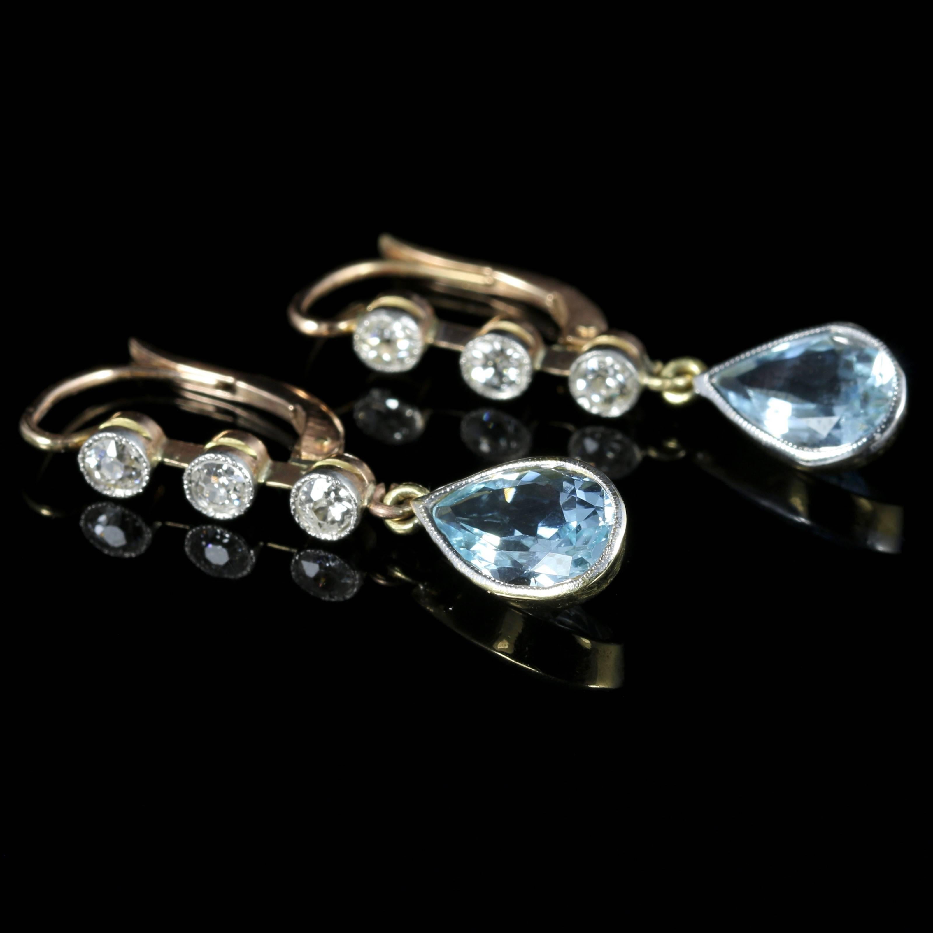 For more details please click continue reading down below...

These fabulous genuine antique Aquamarine and Diamond earrings are Circa 1900.

Set in 18ct Yellow Gold.

Adorned with a trilogy of Diamonds which are milligrain set and lead down to a