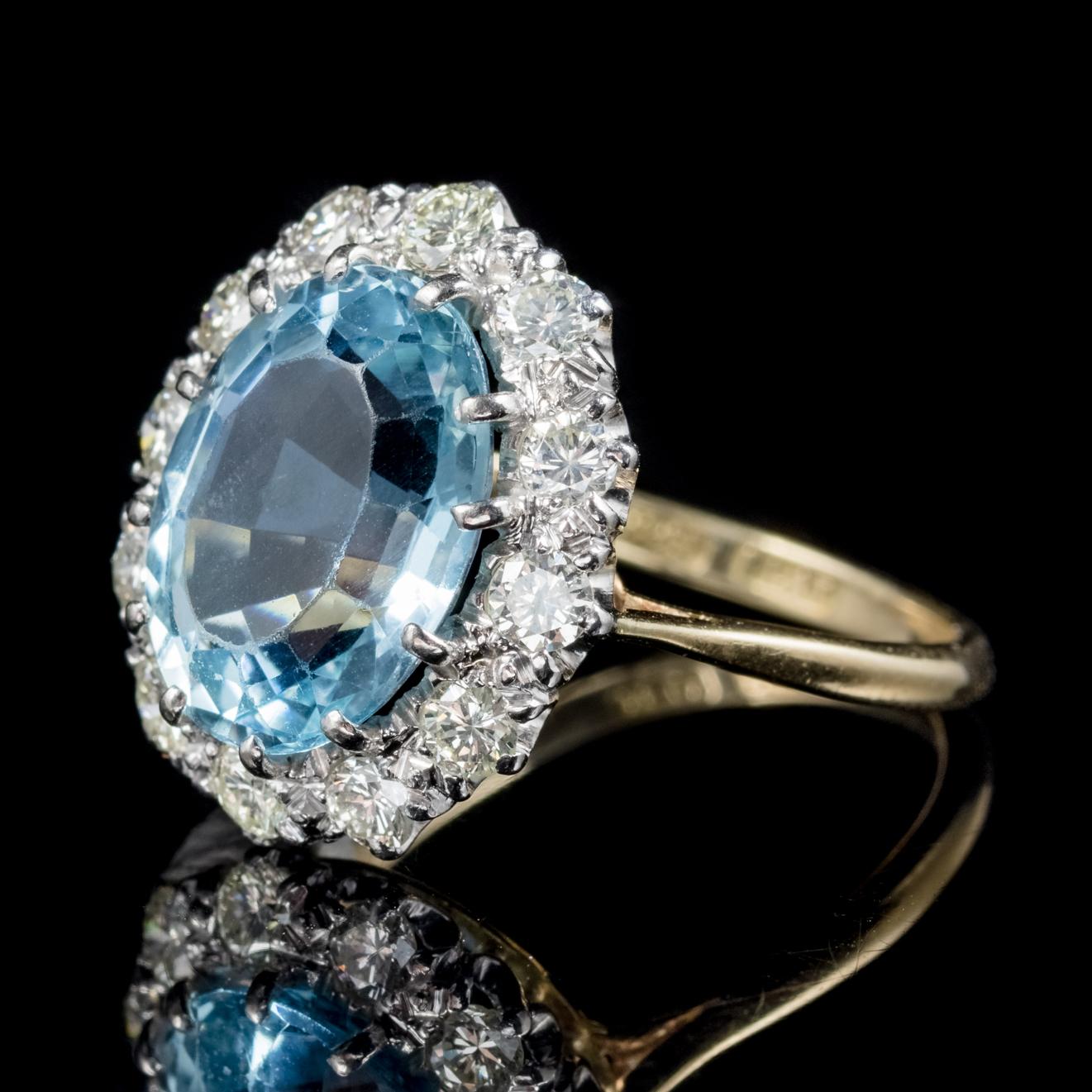 A spectacular antique Aquamarine and Diamond ring from the Victorian era, Circa 1900. 

Adorned with a magnificent ocean blue Aquamarine which is approx. 6ct and surrounded by sparkling Diamonds. 

Aquamarine is adored for its beautiful clear Ocean