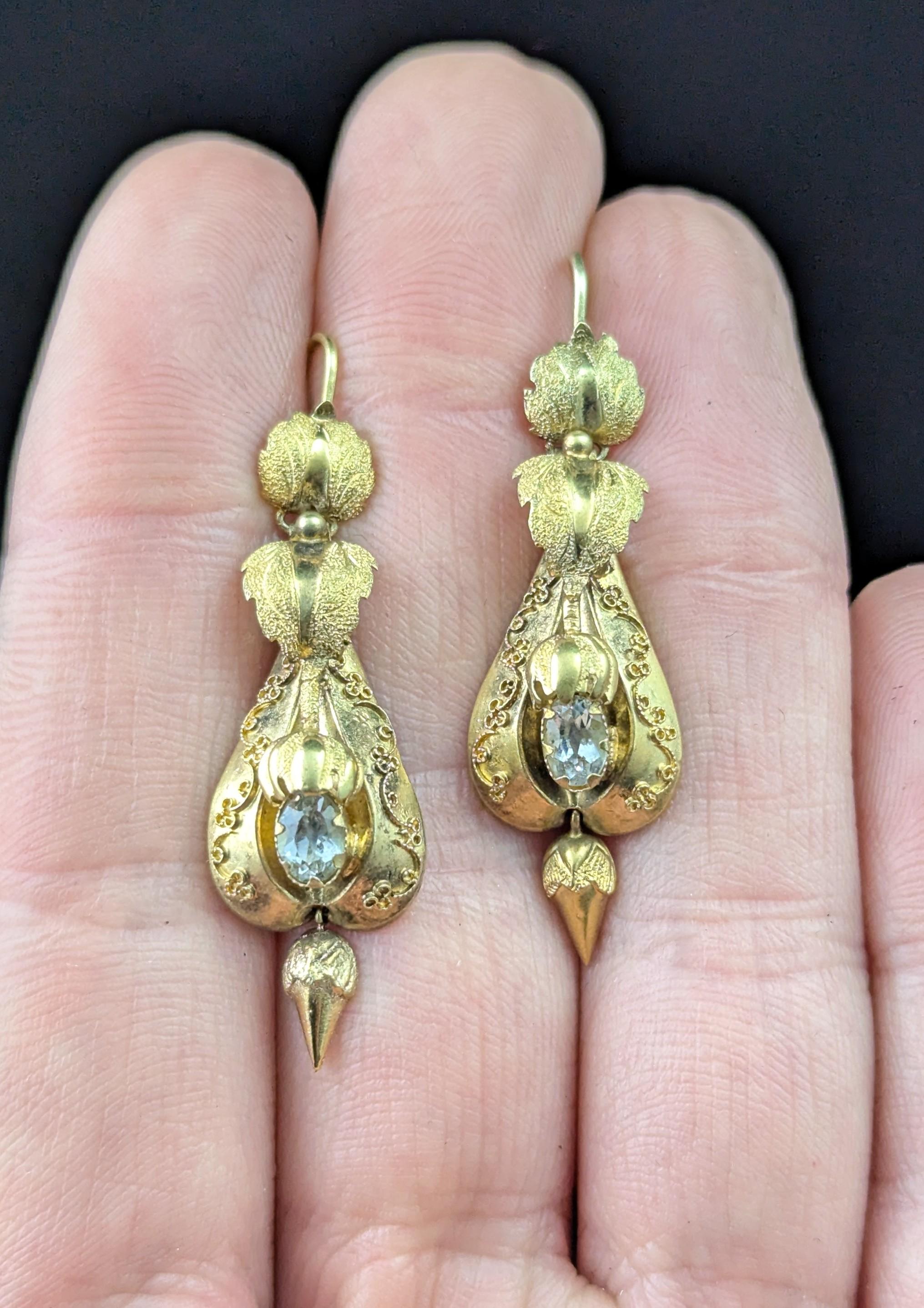 These antique Victorian Aquamarine drop earrings are simply divine!

Such fine craftsmanship and attention to detail, they are crafted in rich 15ct yellow gold, door knocker style drops hinged from the top with a fantastic leaf and flora