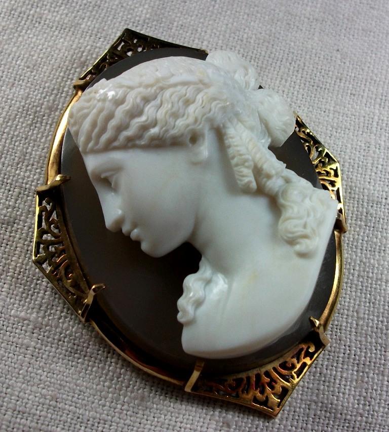 This is an outstanding and gorgeous Museum Quality hard stone cameo brooch depicting Ariadne, the immortal wife of the wine God Dionysus. The  cameo is very large and can be worn as a brooch or as a pendant, the bale can be hidden on the back when