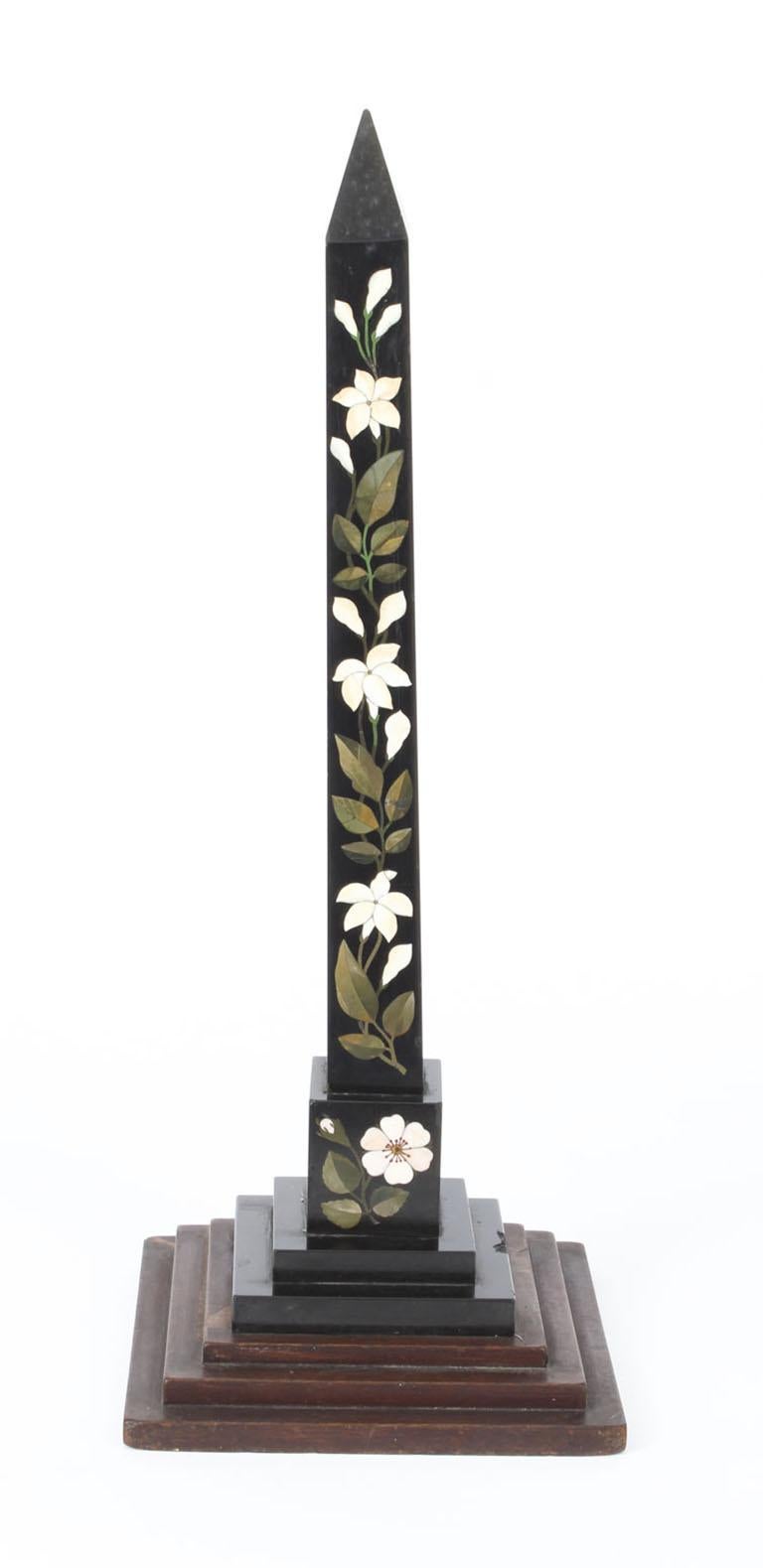 This is a wonderful Derbyshire Ashford pietra dura obelisk, inlaid with lillies, circa 1880 in date.

The obelisk is beautifully inlaid with a Pietra Dura of white flowers and malachite leaves.
This delightful object will look beautiful on