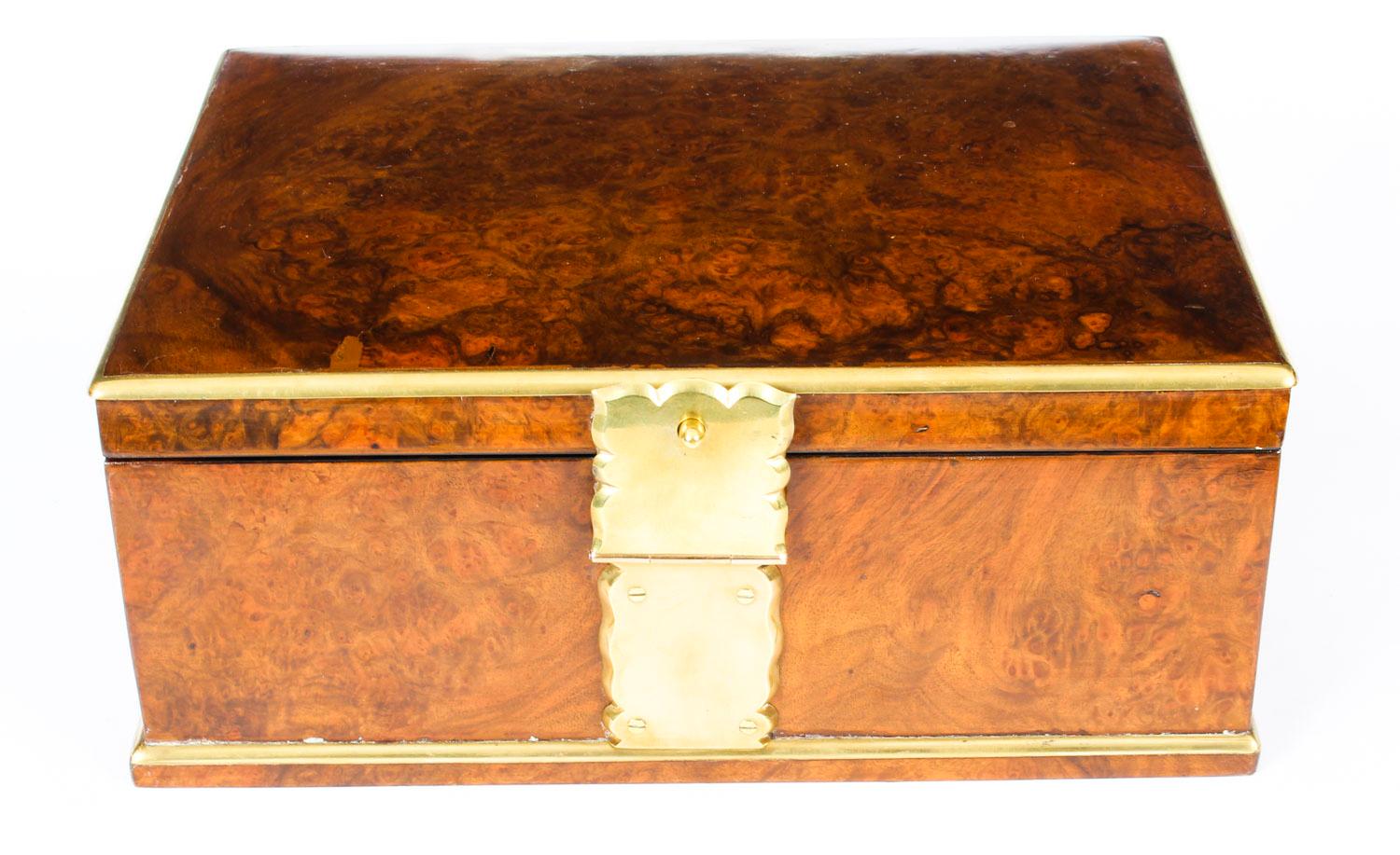 This is a wonderful antique burr walnut jewelry casket with beautiful ormolu strap work by the world famous retailer Asprey, circa 1860 in date.
 
 Of domed rectangular form with ormolu banding and catch, opens to a re-fitted plush black suede and