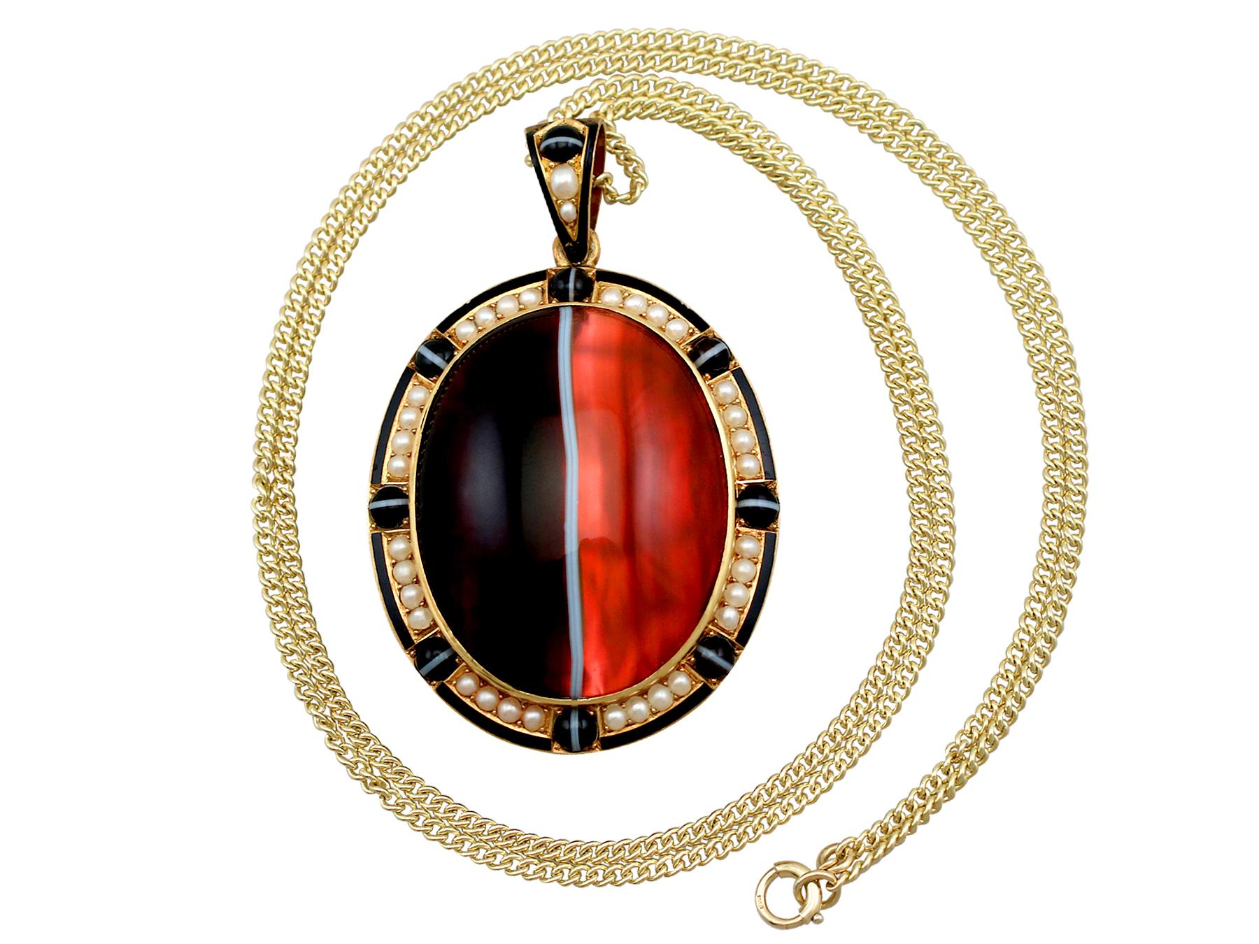 A stunning antique Victorian banded agate and seed pear, 18 karat yellow gold locket and chain; part of our diverse antique jewelry and estate jewelry collections.

This stunning, fine and impressive antique pearl and agate locket has been crafted