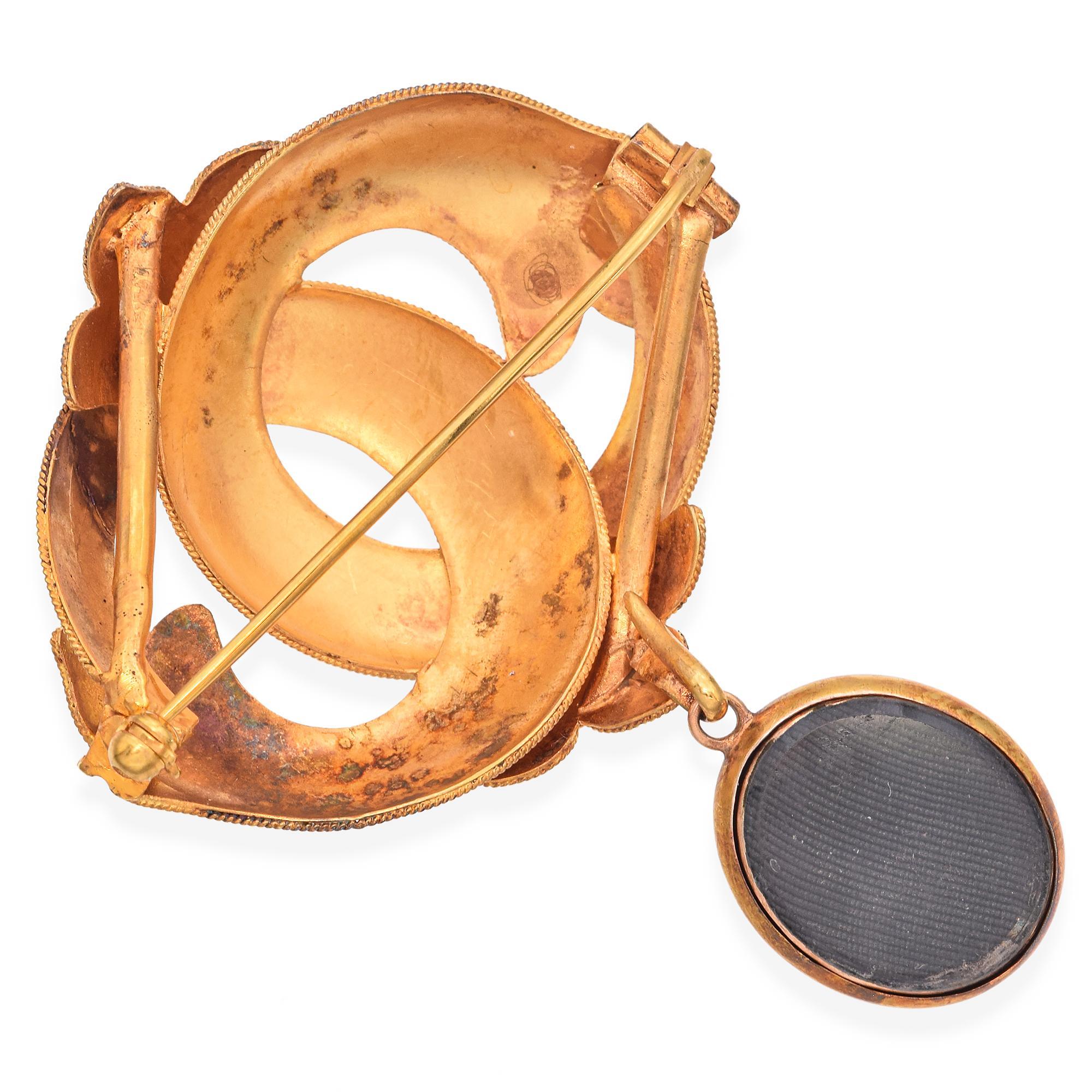 This Victorian brooch is crafted from 20K yellow gold, featuring cabochon-cut garnets with a rich red hue. The intricate design showcases interlocking loops adorned with garnets, complemented by detailed engravings. 
Weight: 9.3 Grams 
Stone: 1.08