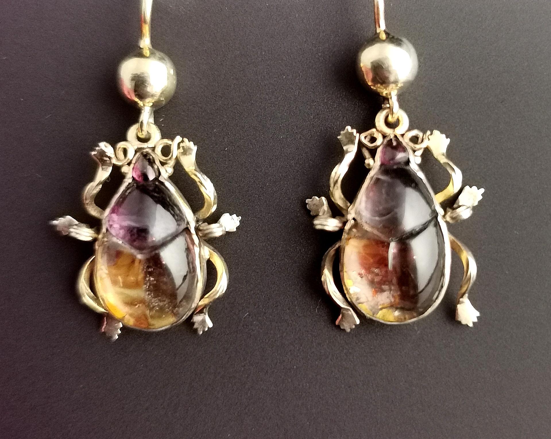 A Beautiful and rare pair of Antique Victorian earrings.

This pair of earrings are just exceptional, designed as beetles they are crafted in 9kt yellow gold with ear wire fasteners.

The beetles are made up from foiled Rock crystal stones with