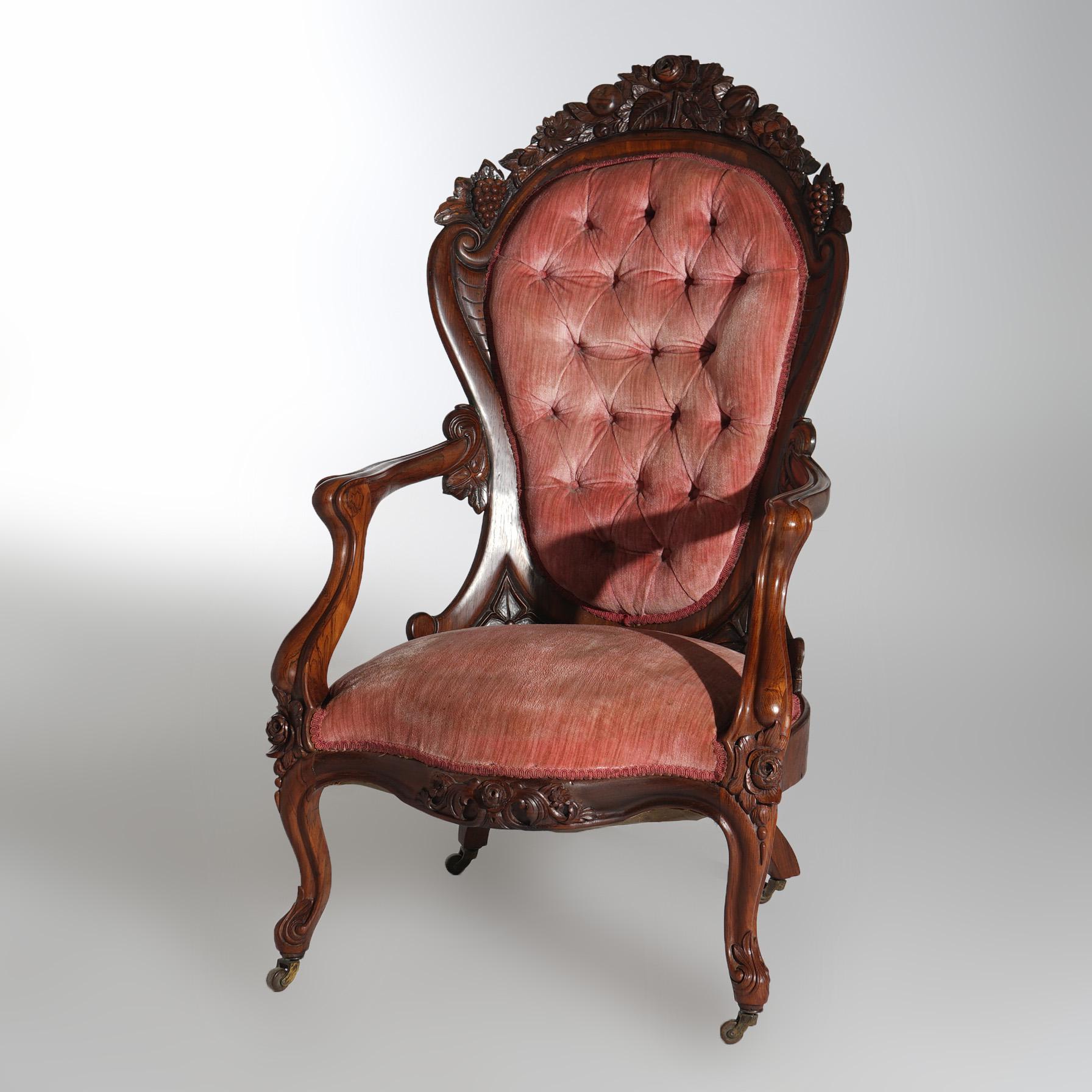 ***Ask About Lower In-House Shipping Rates - Reliable Service & Fully Insured***
An antique Victorian Belter Rococo Rosella armchair offers rosewood construction with carved crest having roses and grapes over upholstered back and seat, raised on