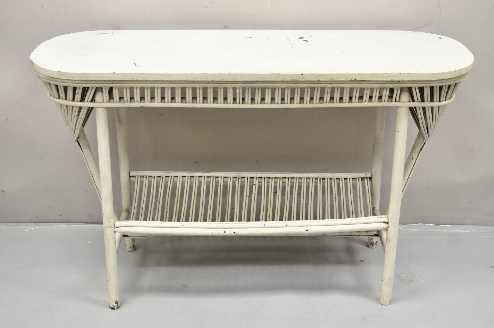 Antique Victorian Bentwood Sculptural Wicker Rattan White Sunroom Console Hall Table. Item features a magazine holder base, oval top, sculptural bentwood details, very nice antique item. Circa Early 1900s. Measurements: 29
