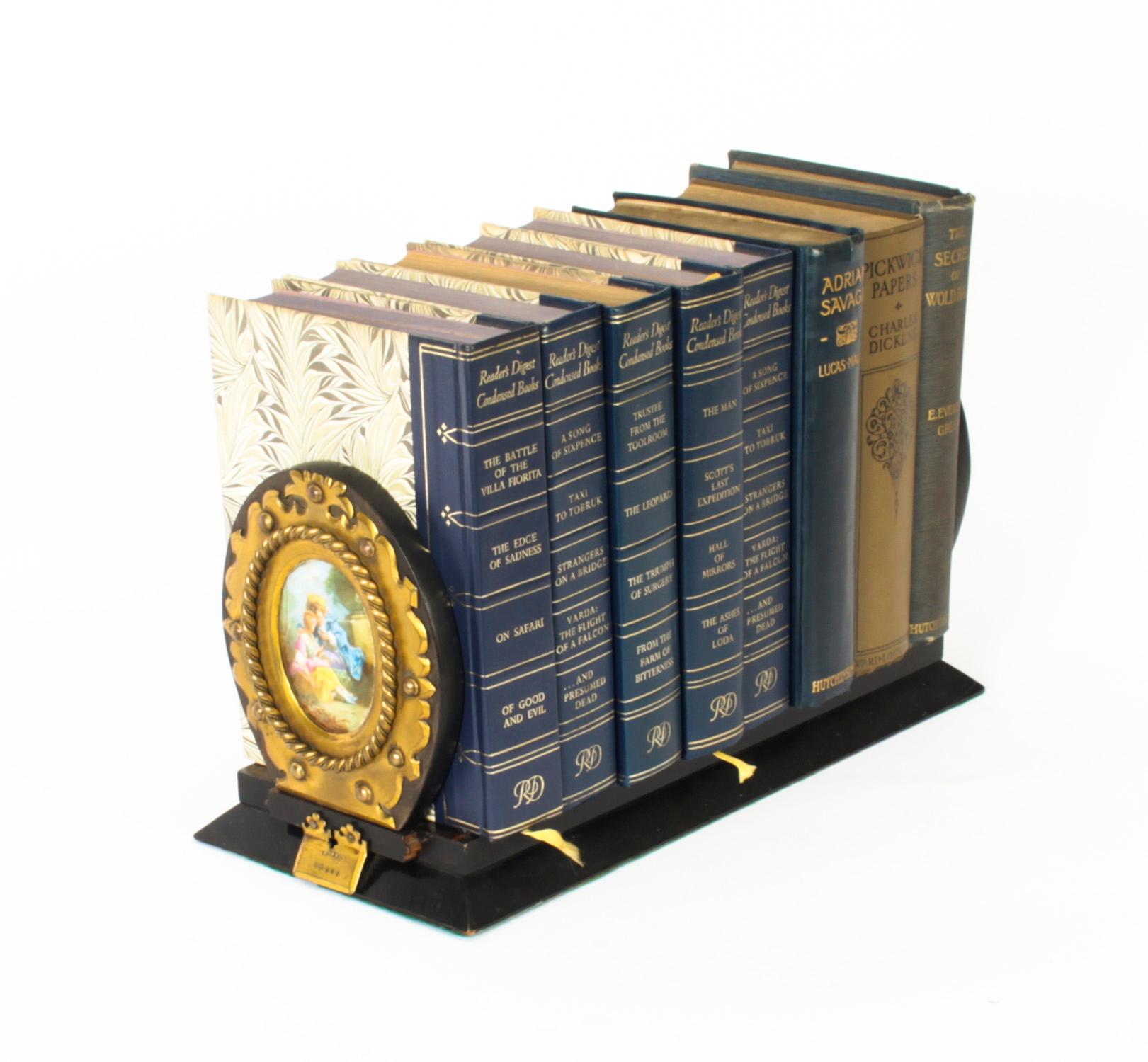 This is a high quality antique Victorian Coromandel and porcelain adjustable book slide, by Betjemann's, 19th Century and circa 1870 in date.

It is made of stunnning coromandel and features a pair of oval gilt brass mounts enclosing Sevres hand