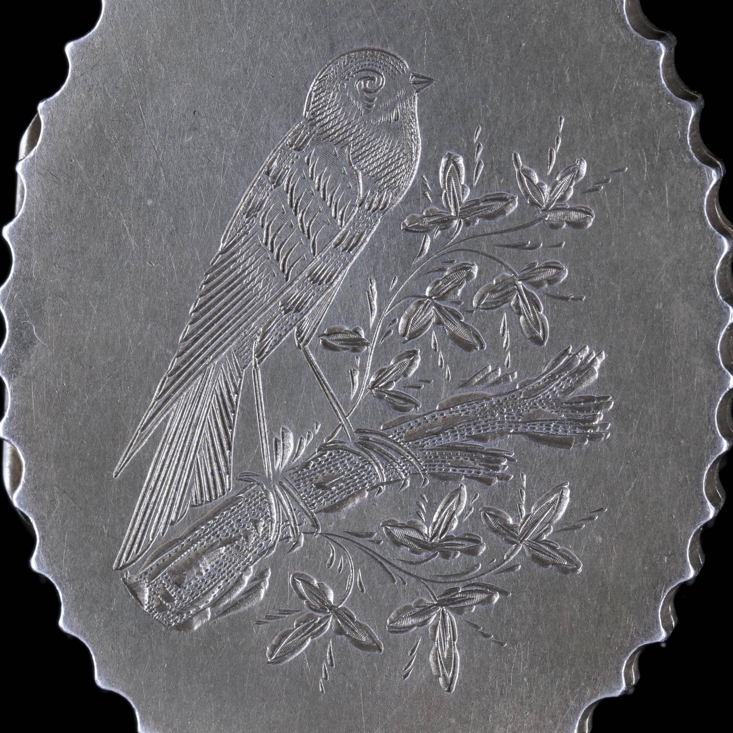 To read more please click continue reading below-

This fabulous antique Sterling Silver bird locket is Victorian, dated Birmingham 1900. 

The piece is adorned on the front with a fabulous engraved bird resting on a branch of leaves. 

Victorian