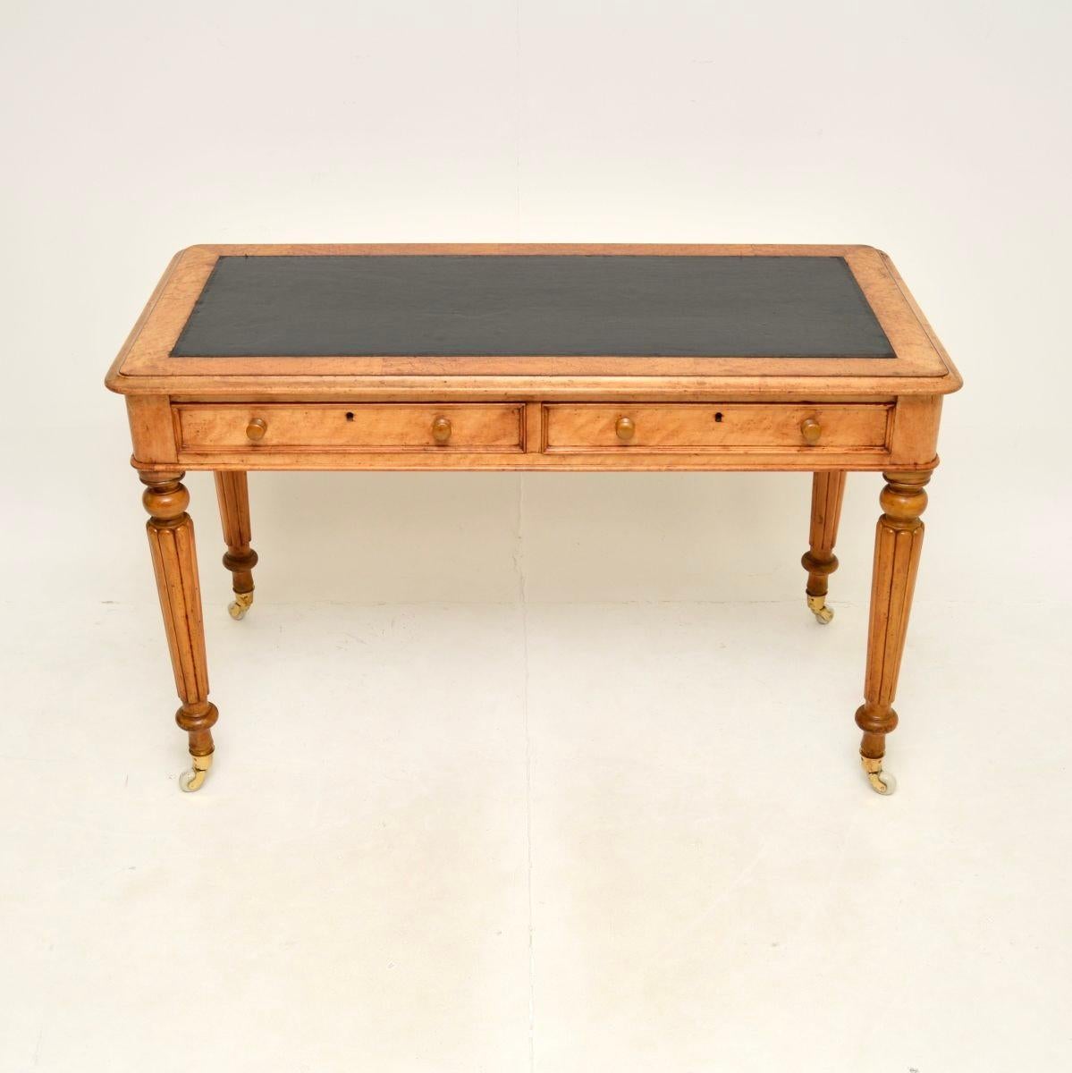A fantastic antique Victorian birds eye maple writing table / desk. This was made in England, it dates from around the 1840-1860 period.

It is of outstanding quality, with gorgeous birds eye maple grain patterns throughout. It stands on bold,