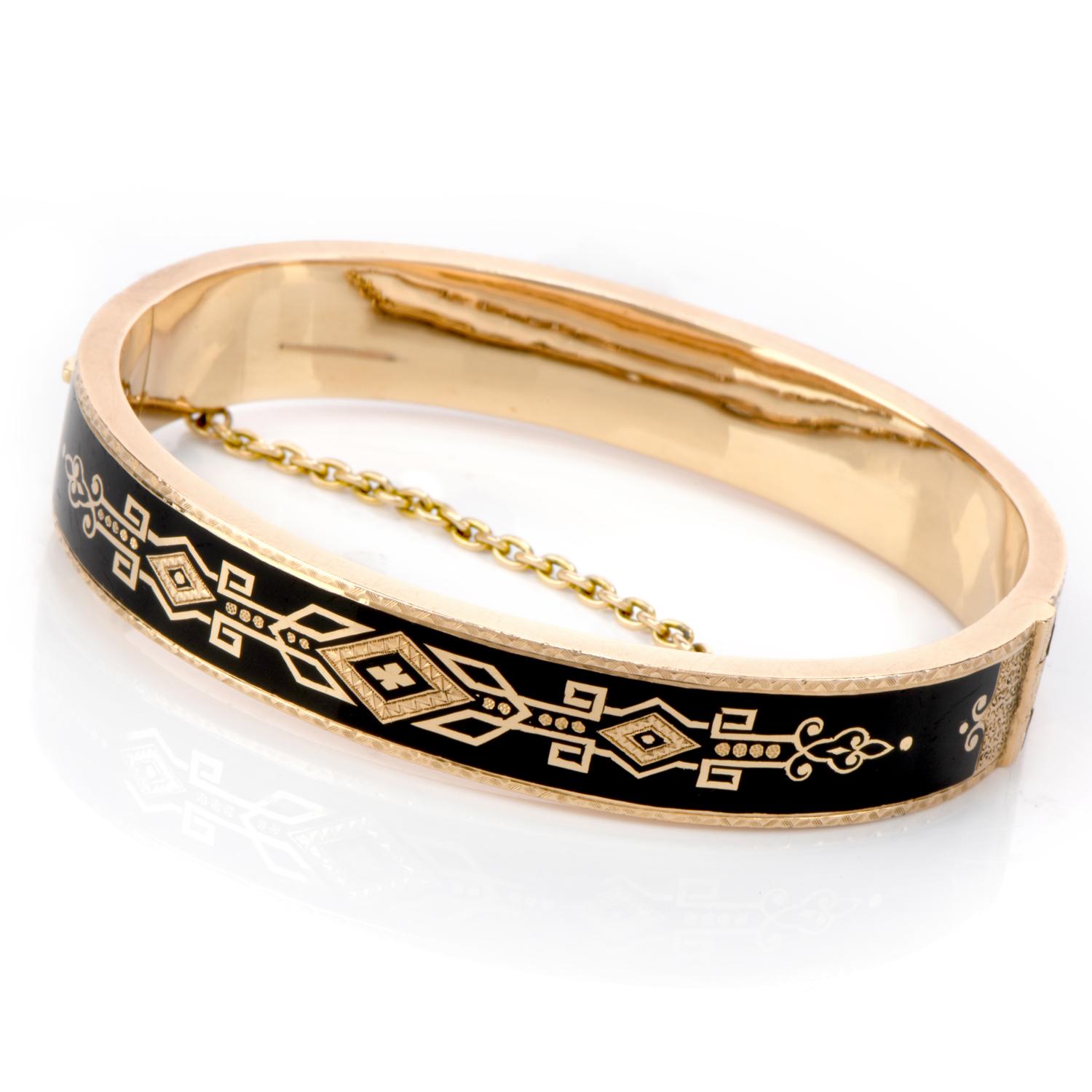 Honor the beloved Victorian Era with this Antique Black Enamel 14K yellow Gold Bangle Bracelet!

This bracelet displays a beautiful and intricate Victorian design on the deep black enamel background.  It weighs in at 16.2 grams and measures at a 6