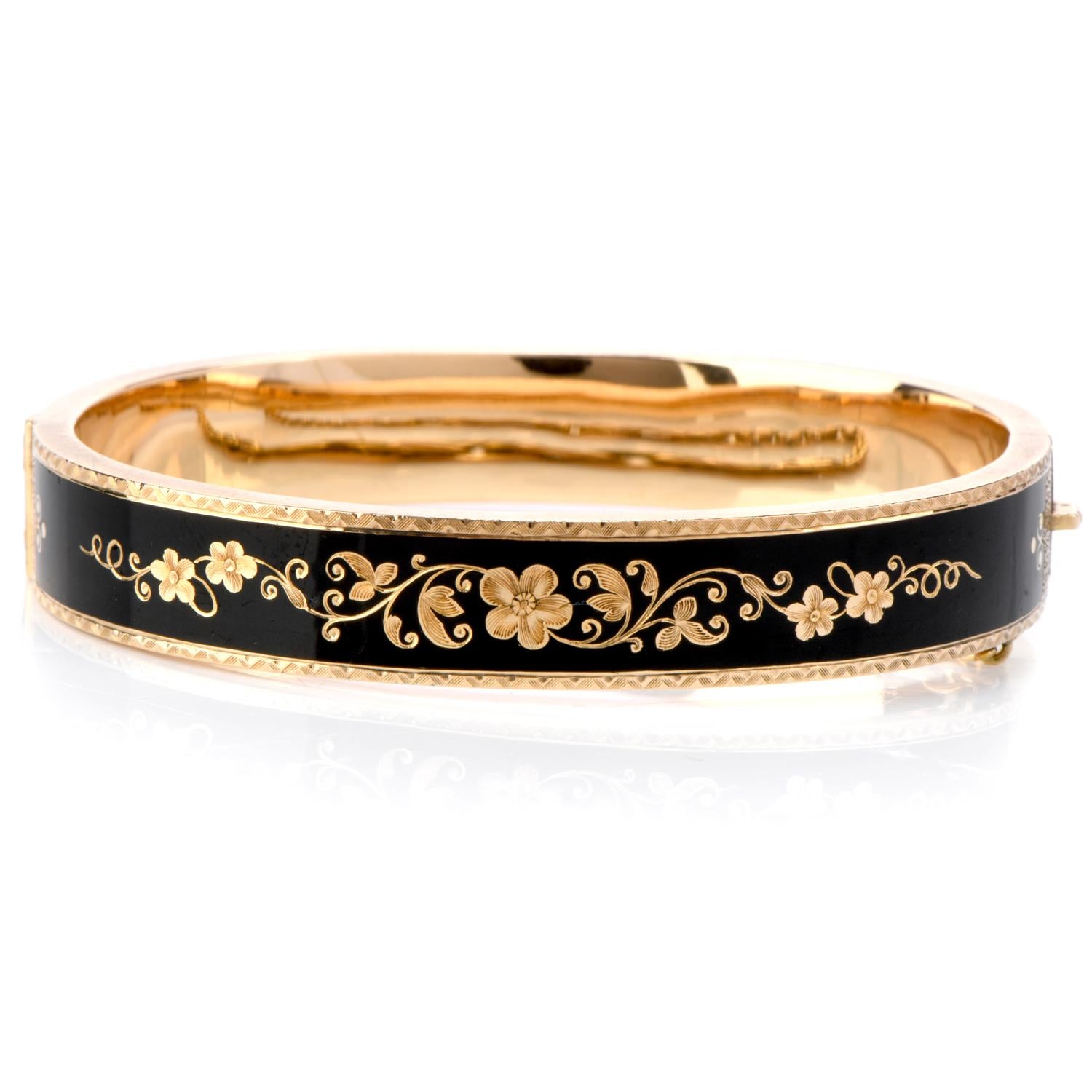 Honor the beloved Victorian Era with this Antique Black Enamel 14K yellow Gold Bangle Bracelet!

This bracelet displays a beautiful and intricate Victorian design on the deep black enamel background.  It weighs in at 16.2

grams and measures at a 6