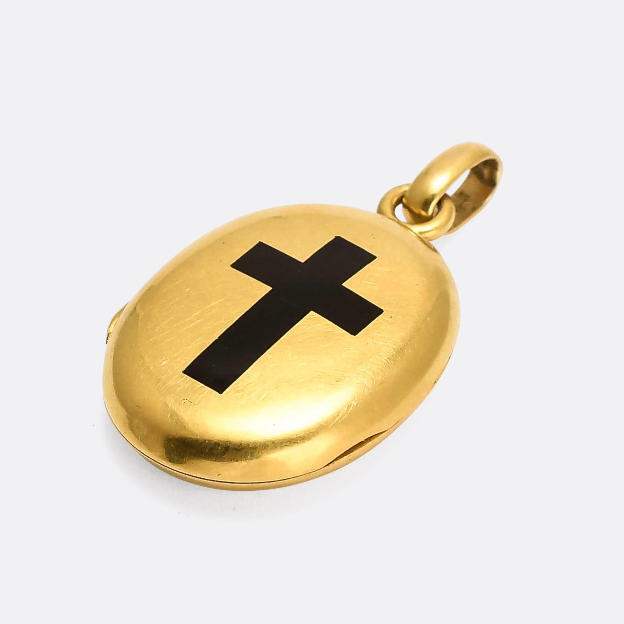 A smaller scale Victorian black enamel cross locket dating from the latter half of the 19th Century. It's crafted in 18 karat yellow gold, and measures just over an inch in length. Particularly good quality, and remaining in great condition with no