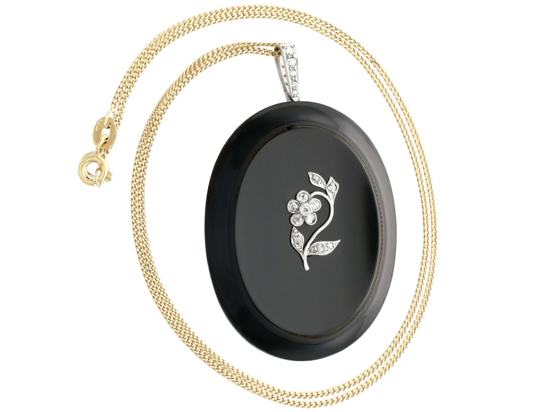 A stunning, fine and impressive antique black onyx and 0.23 carat diamond, 18 karat white and yellow gold pendant; part of our diverse Victorian gemstone jewelry and estate jewelry collections.

This stunning Victorian pendant has been crafted in