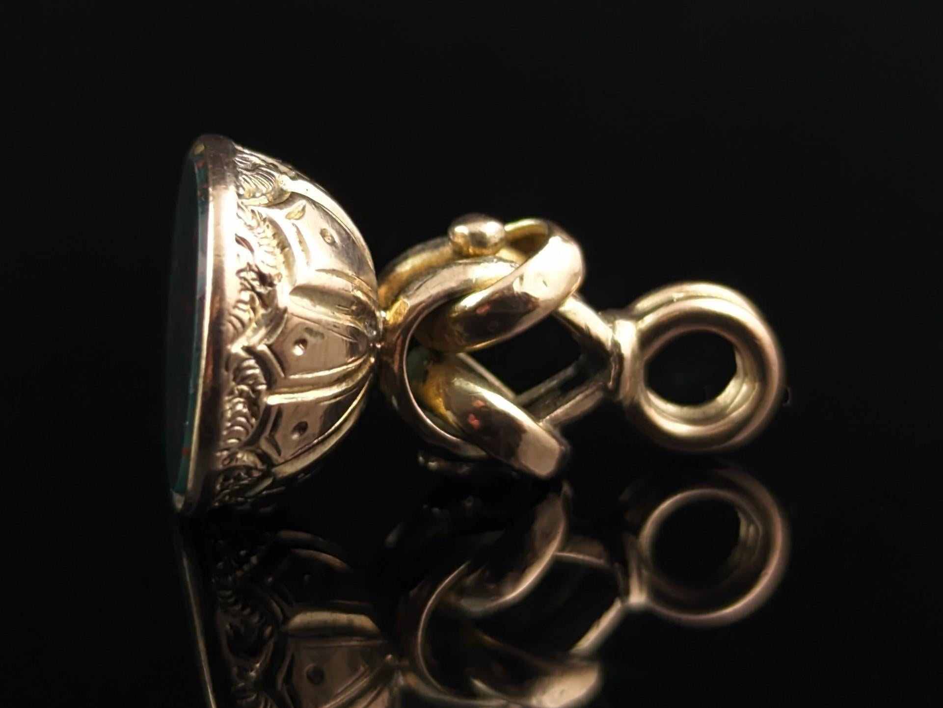 A gorgeous antique Victorian era seal fob.

These are such charming and versatile pieces of antique jewellery, the perfect example of functional beauty.

It is a nice unusual knot design almost like a lovers knot with a typical engraved domed base