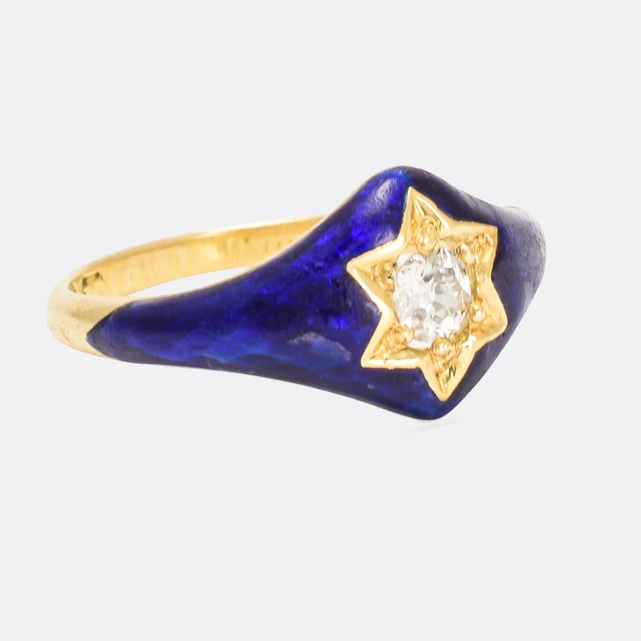 Superb antique star ring set with a central old Euro diamond within a sea of royal blue enamel. It dates from the mid Victorian era, with inscription to the inner band indicating 1858, and surprisingly features a secret locket compartment to the