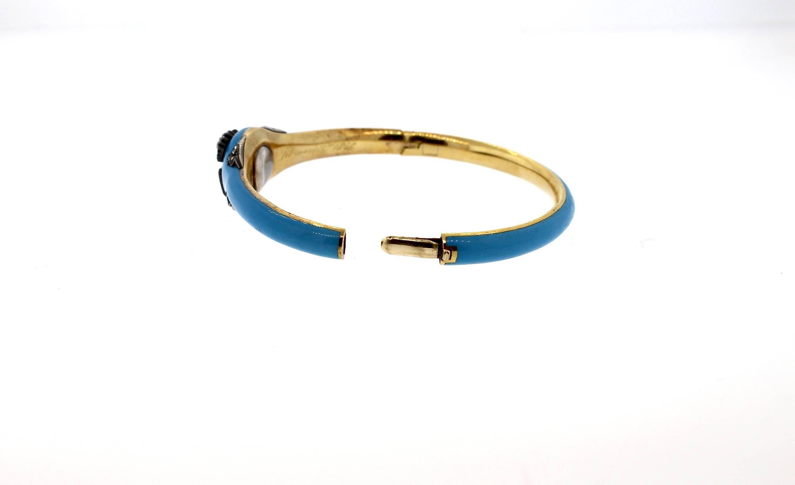 A collectible antique Victorian blue enamel bangle bracelet with rosecut diamonds, circa 1840. This bright robins egg blue Victorian enamel bangle is slim and delicate, yet perfectly feminine and fashionable.  It is made in 18k gold and silver tops