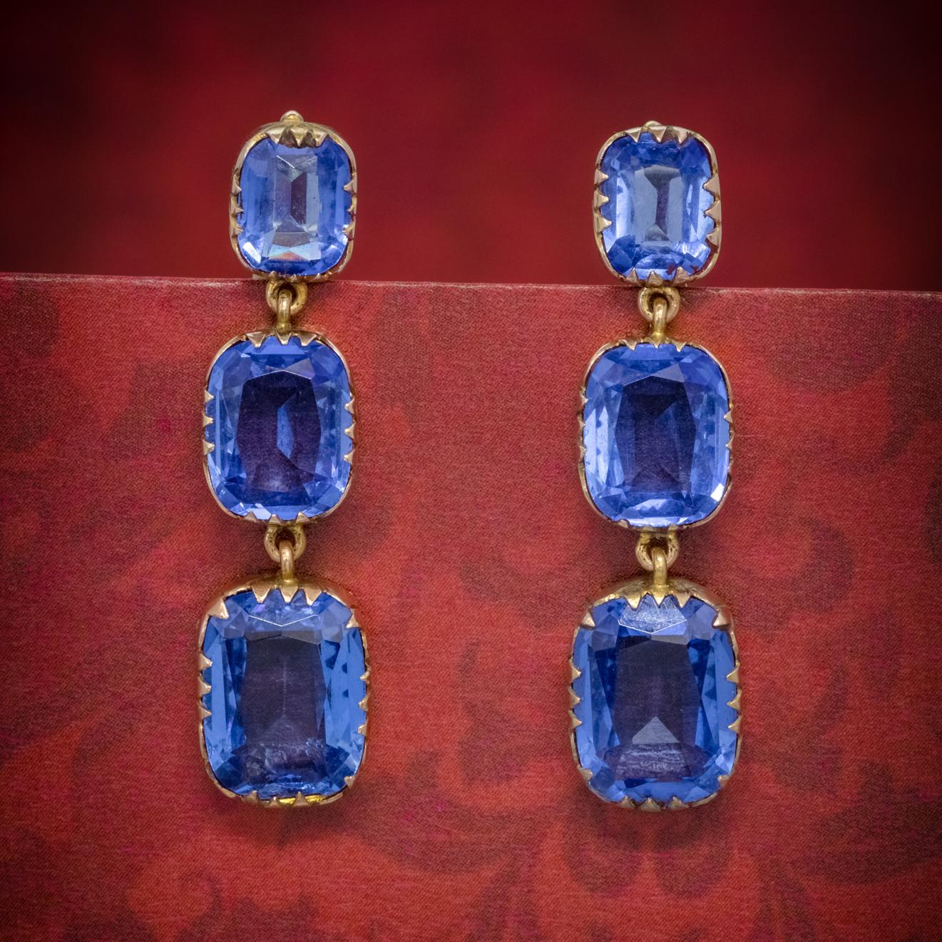 A fabulous pair of Antique late Victorian triple drop earrings set with three beautiful Bristol blue Paste Stones, approx. 10ct in each earring, 20ct in total.  

Paste is a transparent flint glass that simulates the fire and brilliance of