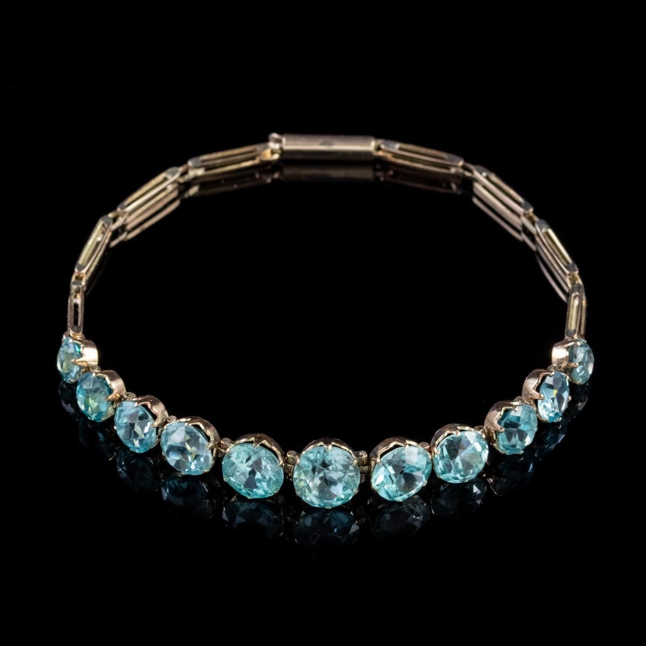 A beautiful Antique Victorian 9ct Rose Gold bracelet lined with eleven fabulous Blue Zircons which graduate in size across the front gallery. 

Blue Zircon is a lovely shade of teal/ blue and was once said to bring prosperity and wisdom to its