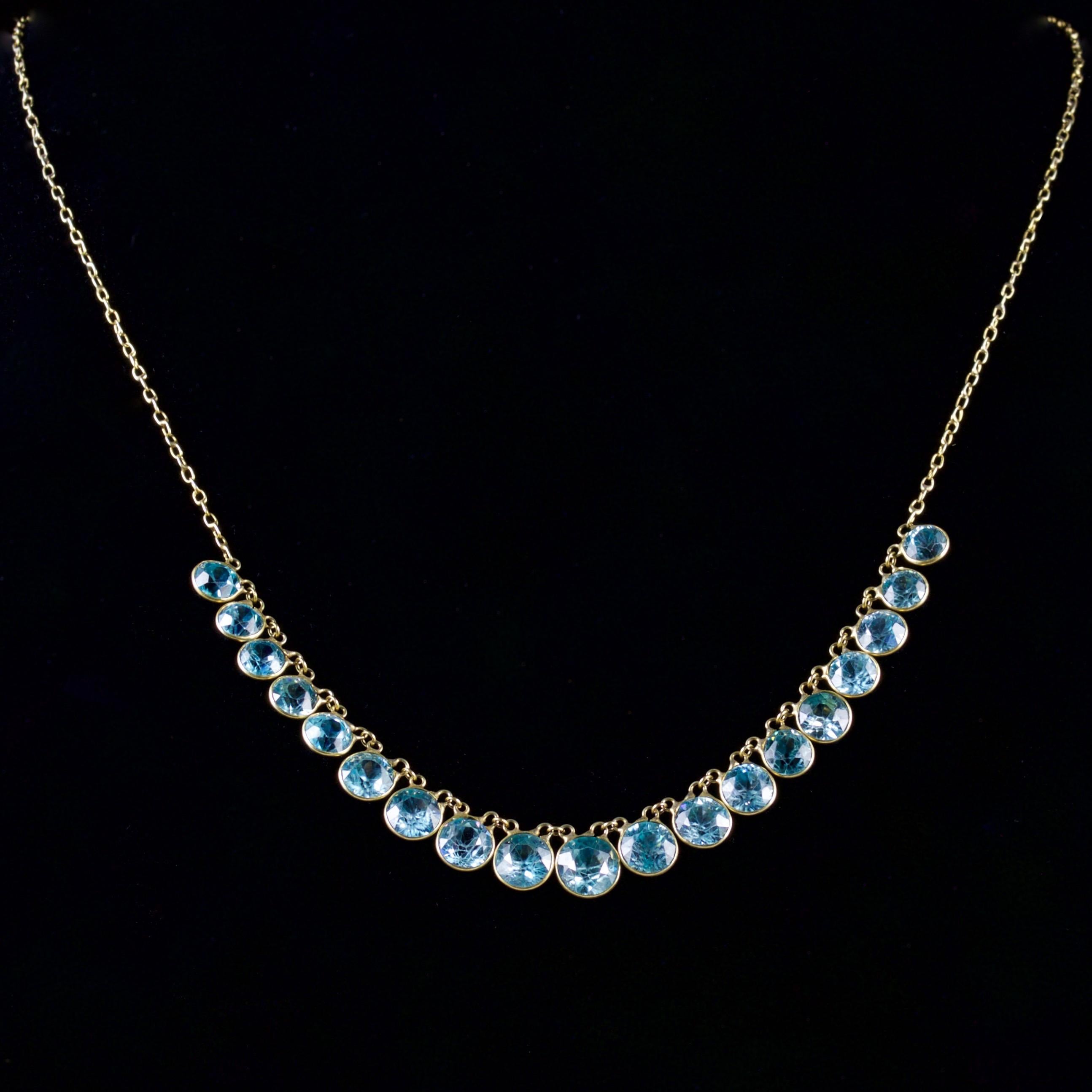 This lovely 9ct Gold Victorian necklace is Circa 1900.

The necklace boasts beautiful blue Zircons which graduate in size.

There are 18ct of bright, blue Zircons on this fabulous necklace.

Blue Zircons have an intense energy that is highly