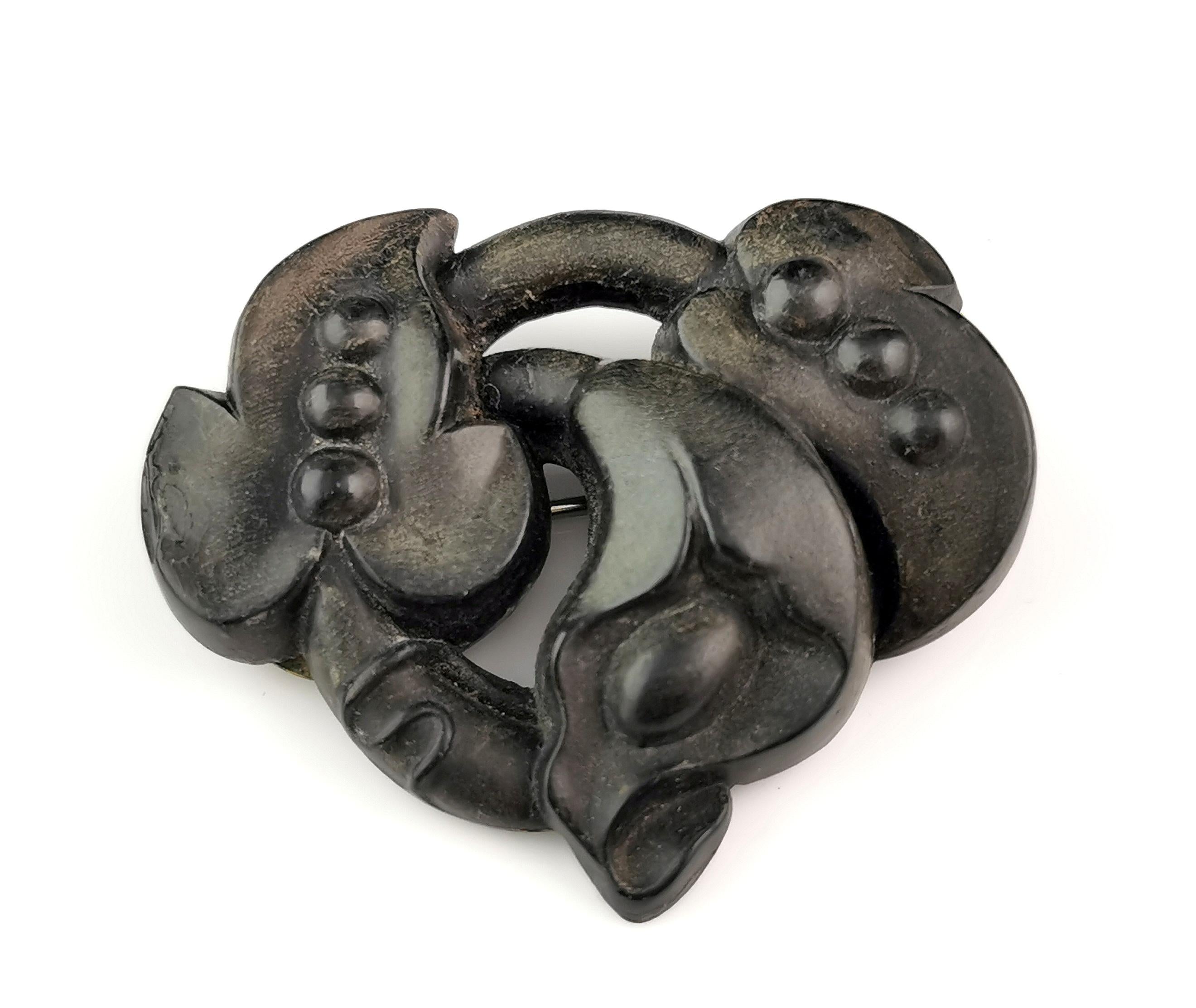 A beautiful antique Victorian bog oak floral brooch.

It is crafted from bog oak which is a type of oak wood that has been buried in a peat bog for hundreds sometimes thousands of years with a rich deep brown / black colour.

It was used in the