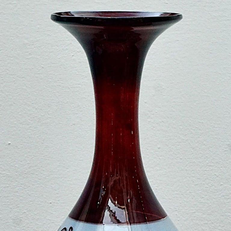 Wonderful antique Victorian Bohemian handmade ruby red vase, with beautiful bird and ivy leaf decoration encircling the vase. Measuring height 32.2 cm / 12.67 inches, and the top is diameter 10.8 cm / 4.25 inches. There is a rough pontil mark. The