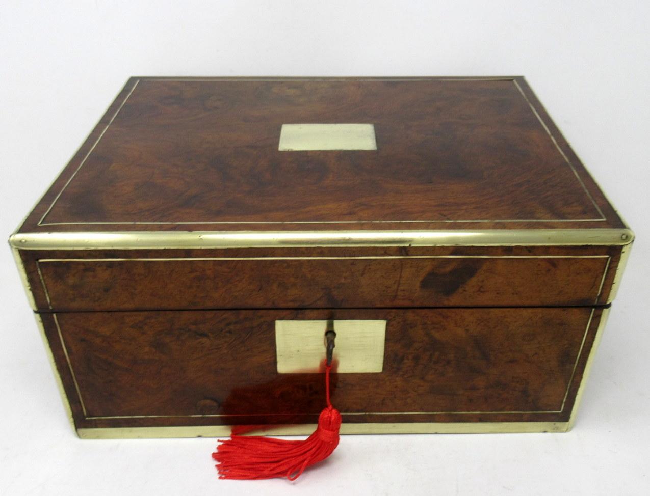 An exceptionally fine quality English well figured solid burr walnut ladies or gents travelling writing slope of outstanding quality and generous proportions. Third quarter of the Nineteenth Century. 

The hinged lid opening to reveal a fitted