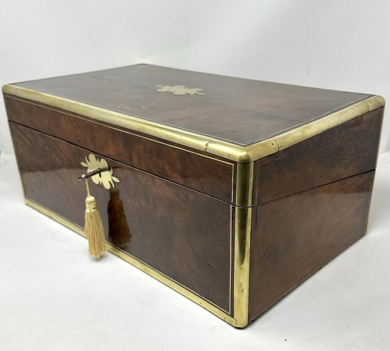 An Exceptionally fine Quality English Well Figured Solid Burr Walnut Ladies or Gents Travelling Writing Slope of outstanding quality and quite large proportions. Third quarter of the Nineteenth Century. 

The hinged lid opening to reveal an