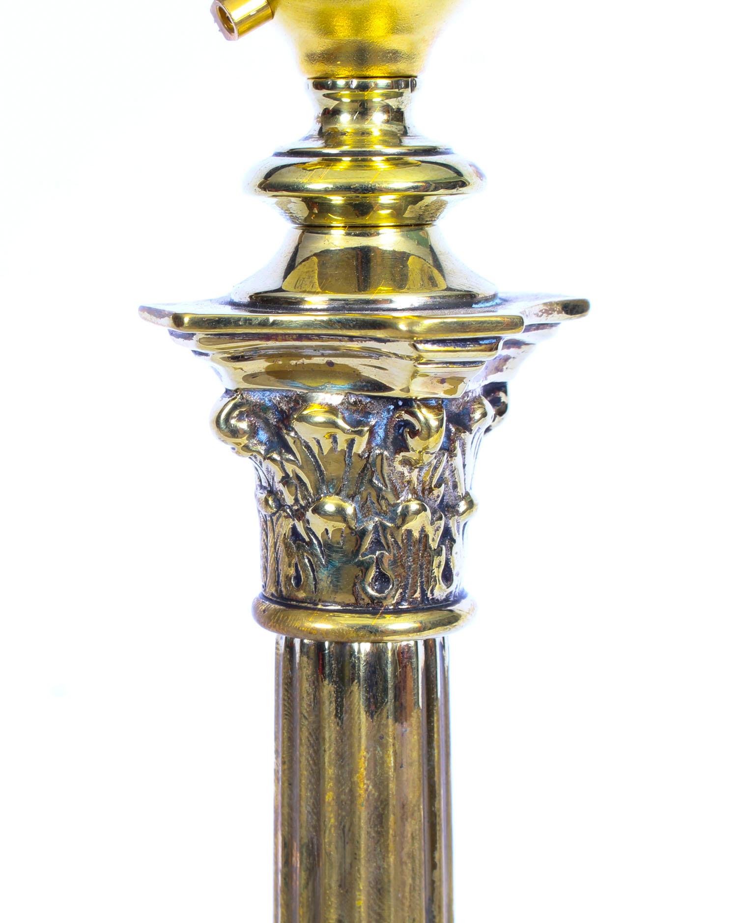 A late 19th century English antique polished brass Corinthian column table lamp light raised on a weighted stepped square pedestal base. Rewired. Measures: 41cm x 13cm x 13cm.

This is a splendid antique Victorian brass Corinthian column table lamp