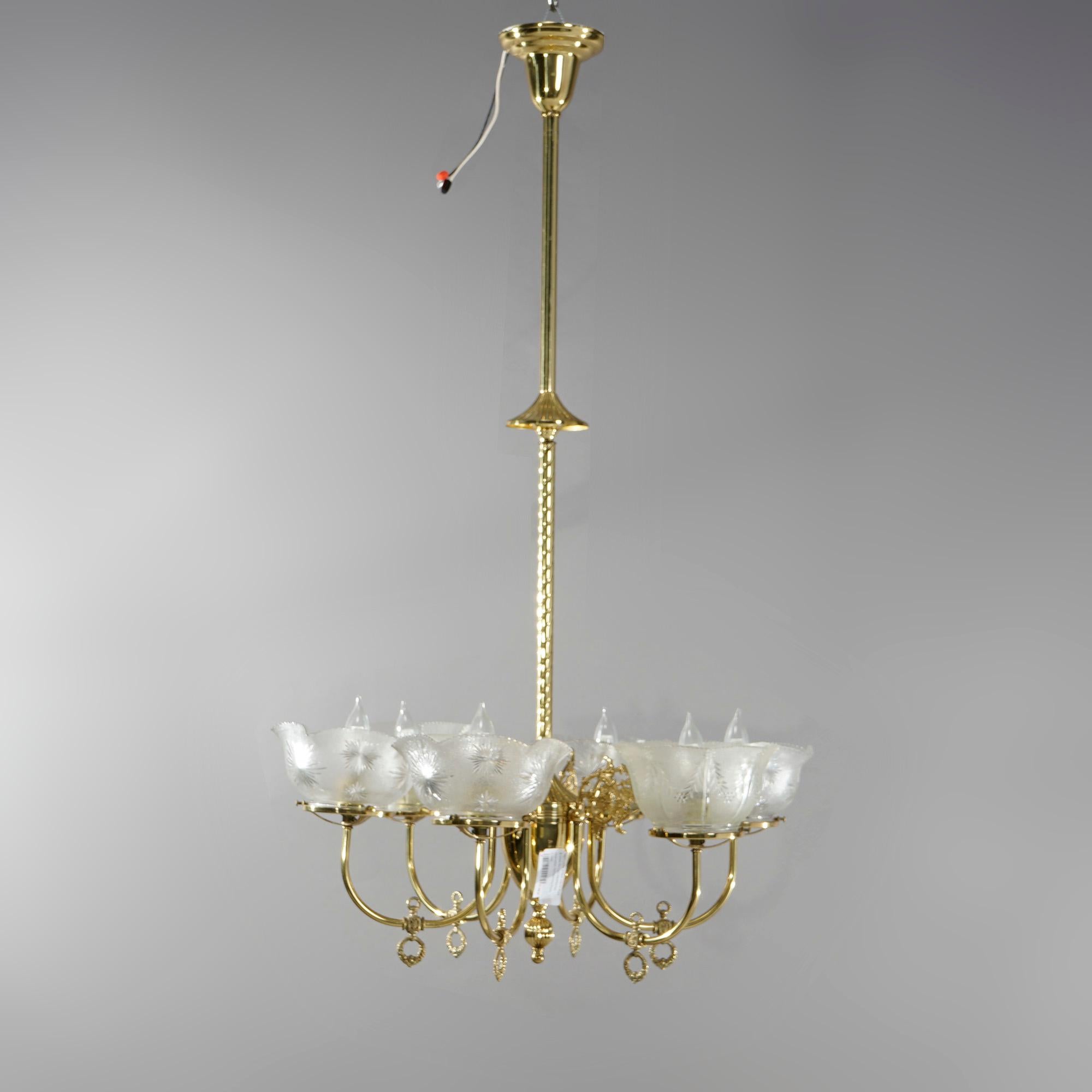An antique Victorian electrified gas chandelier offers brass frame with rope twist shaft having six scroll form arms terminating in etched glass shades (non-matching), c1890

Measures - 44.5''H x 24''W x 24''D.

Catalogue Note: Ask about DISCOUNTED