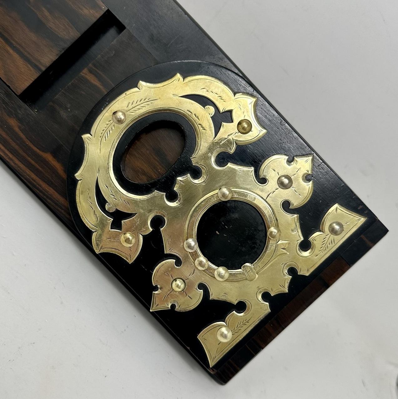 An Exceptionally fine Quality Early Victorian English Well Figured Polished Coromandel Gentleman’s Library Adjustable Table Book Holder, firmly attributed to renowned Furniture Makers and Retailer Chamberlain King & Jones Birmingham. 

Each