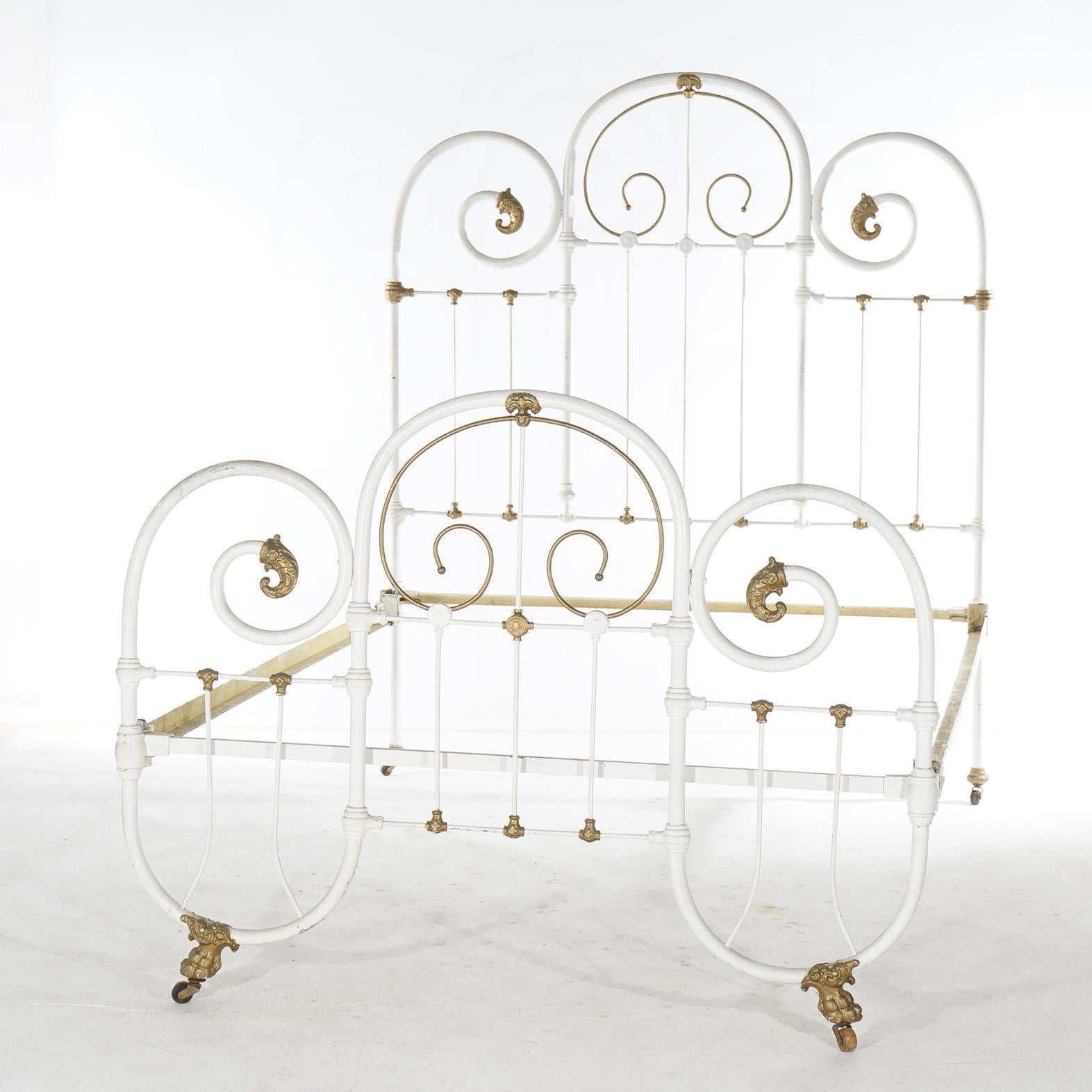 An antique Victorian double bed frame offers iron and brass scroll form frame, c1890

Measures - Headboard 64.5