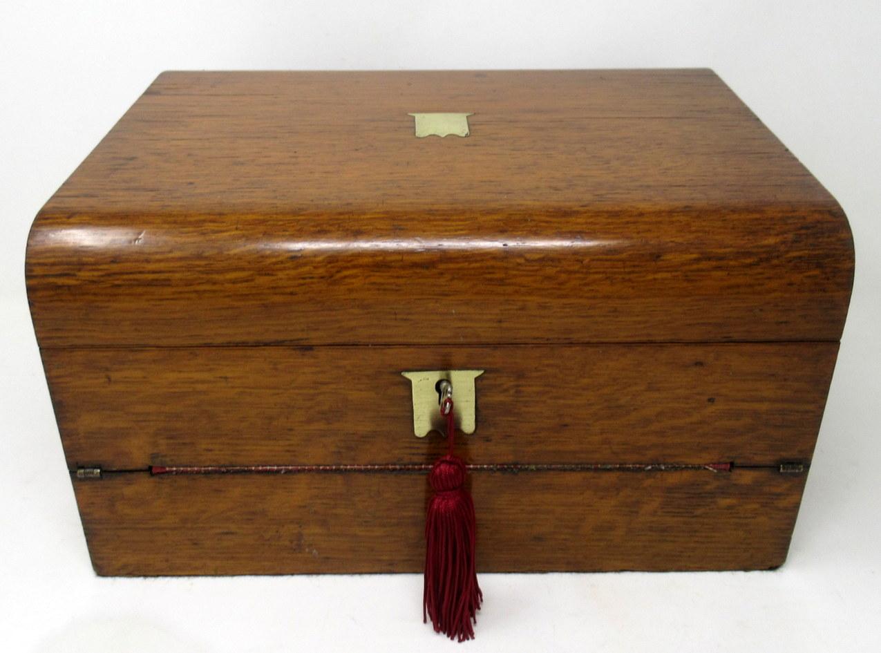 An Exceptionally fine quality English well figured solid pale mahogany ladies or gents traveling writing slope of outstanding quality and compact proportions. Last half of the Nineteenth Century. 

The upper hinged half opening to reveal a fitted