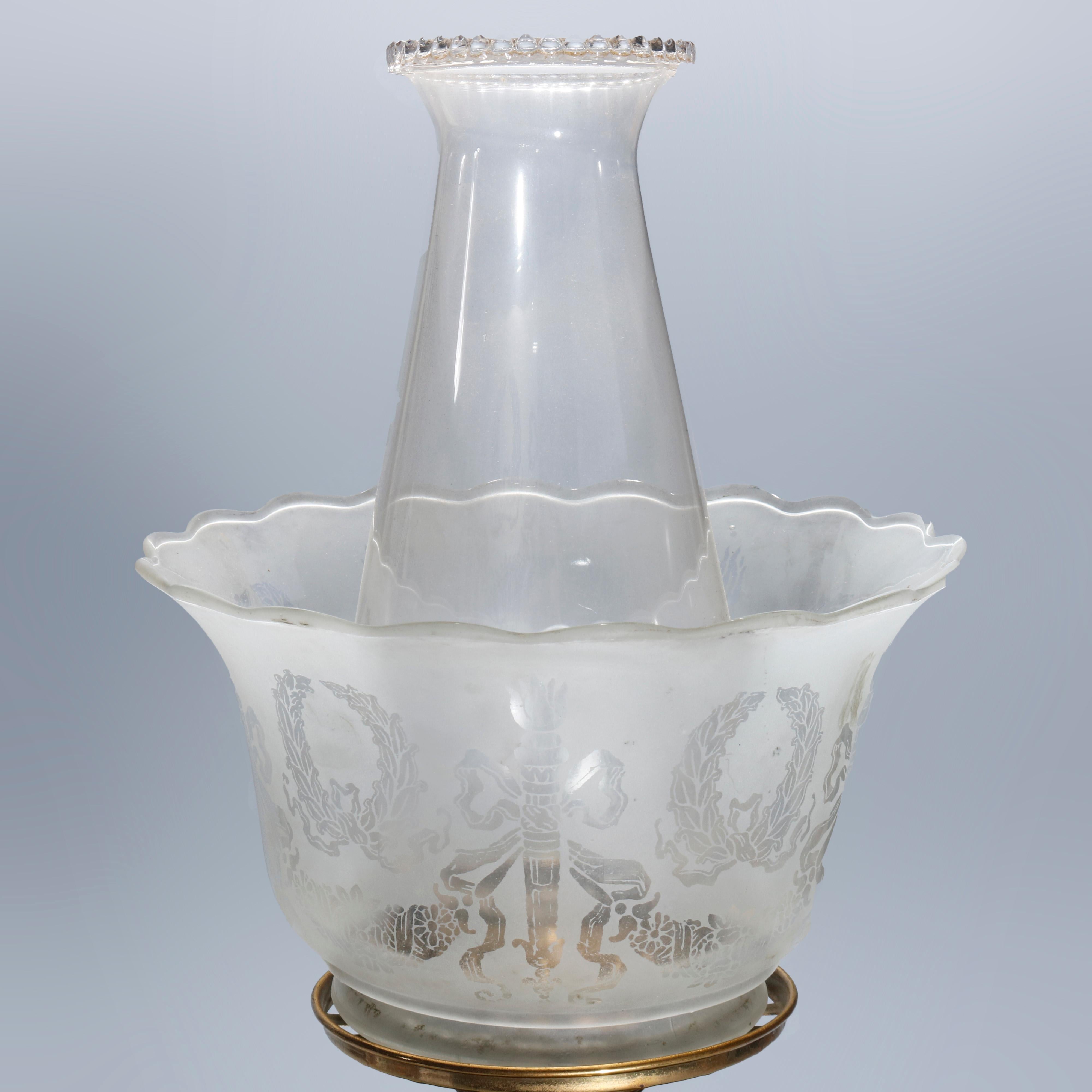 An antique Victorian Astral Solar Lamp offers etched glass ruffled rim shade surmounting brass font and seated on marble base, circa 1880.

Measures: 14.25