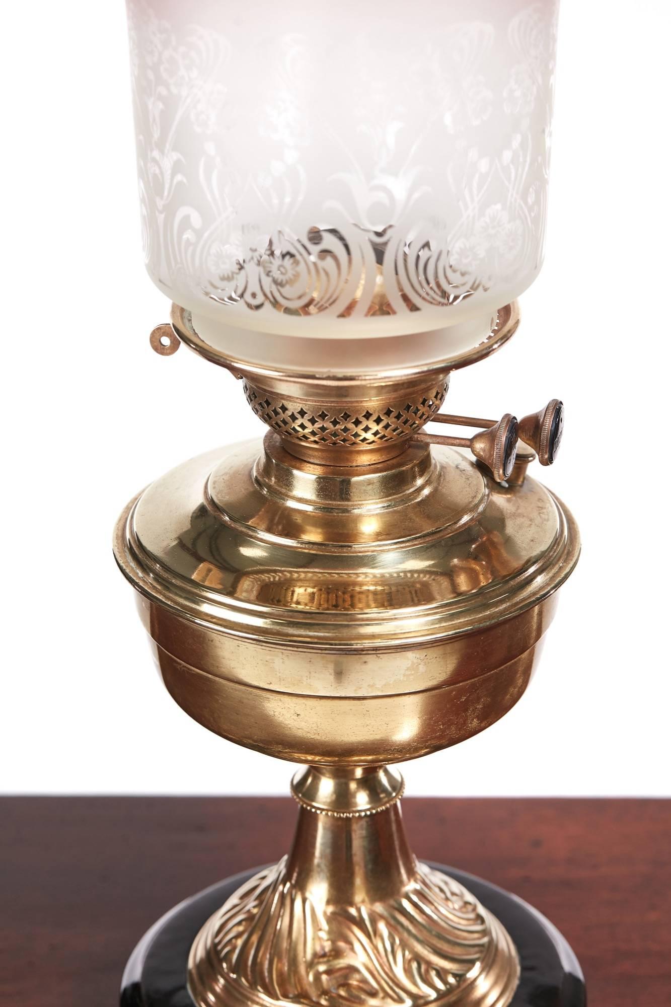 Antique Victorian brass oil lamp with a stepped circular base, brass front and Hinks duplex burner on brass a column with etched pink frilled glass shade,
lovely original condition.
Measures: 7