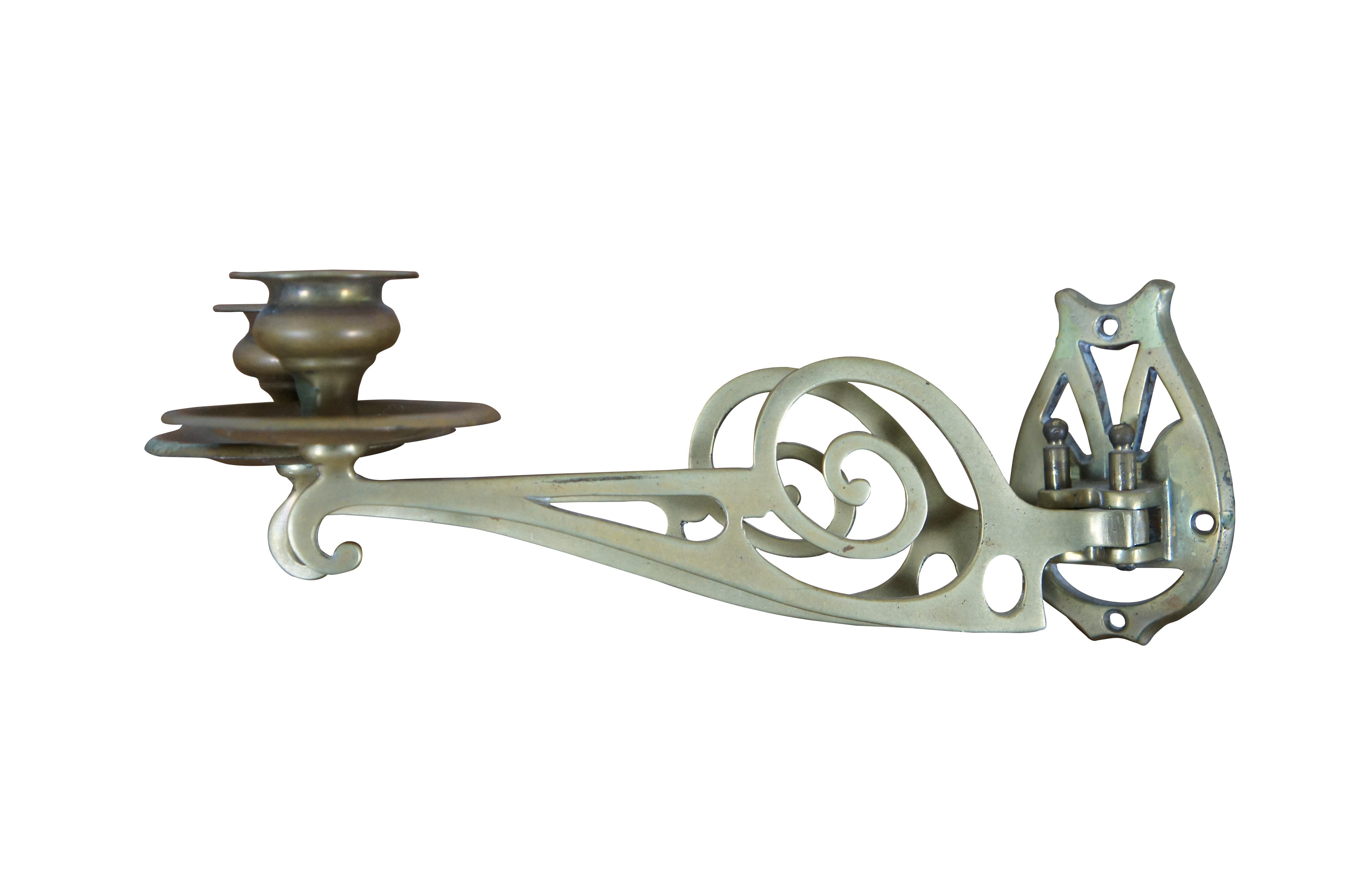 Antique Victorian brass two arm piano candle / candelabra wall sconce, featuring a scrolled and pierced design with hinged swing arm.  Easily removable for mobility and cleaning.


DIMENSIONS

15.25