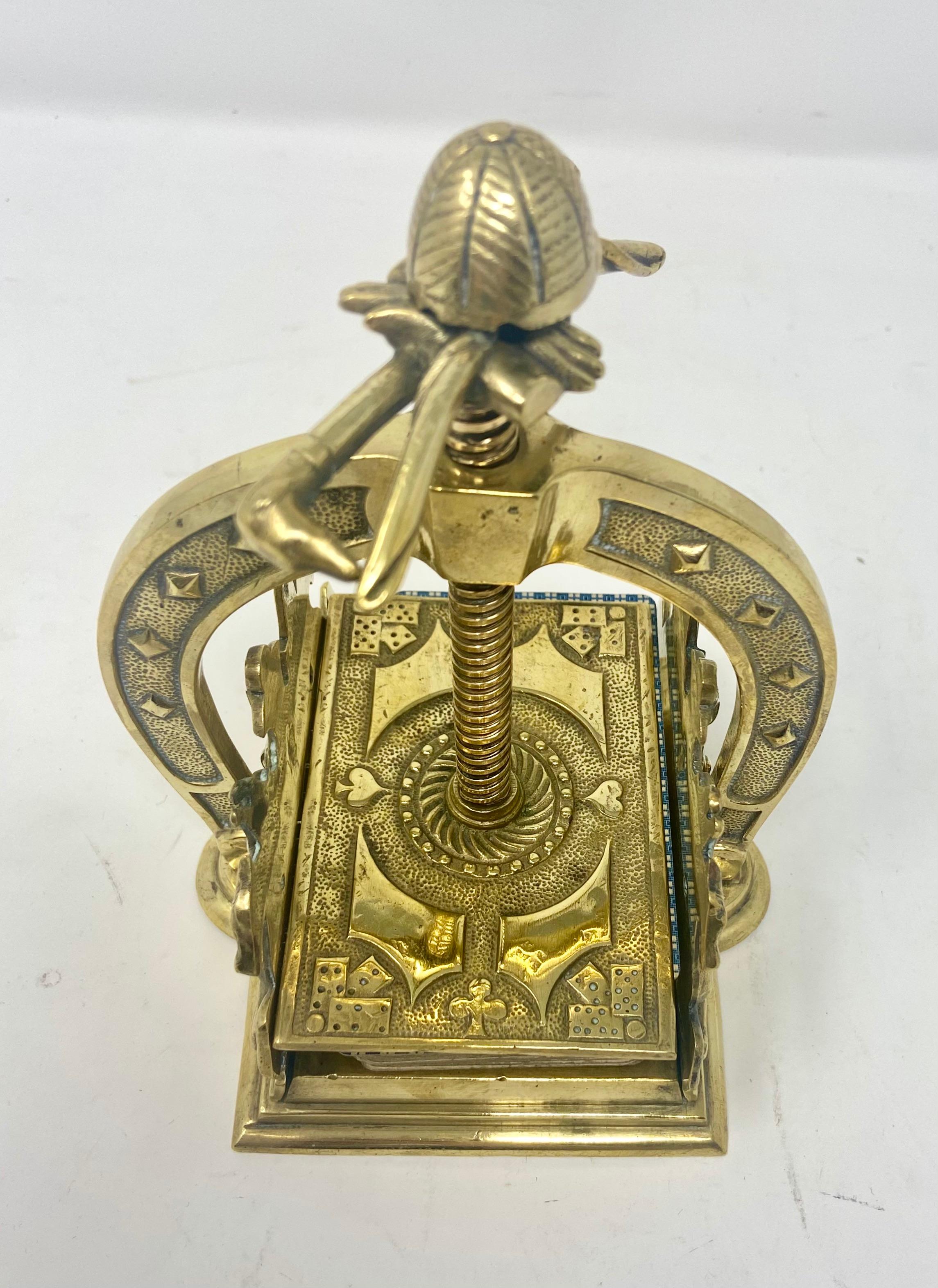 Antique Victorian brass playing card press in a horse racing theme, Circa 1900.
