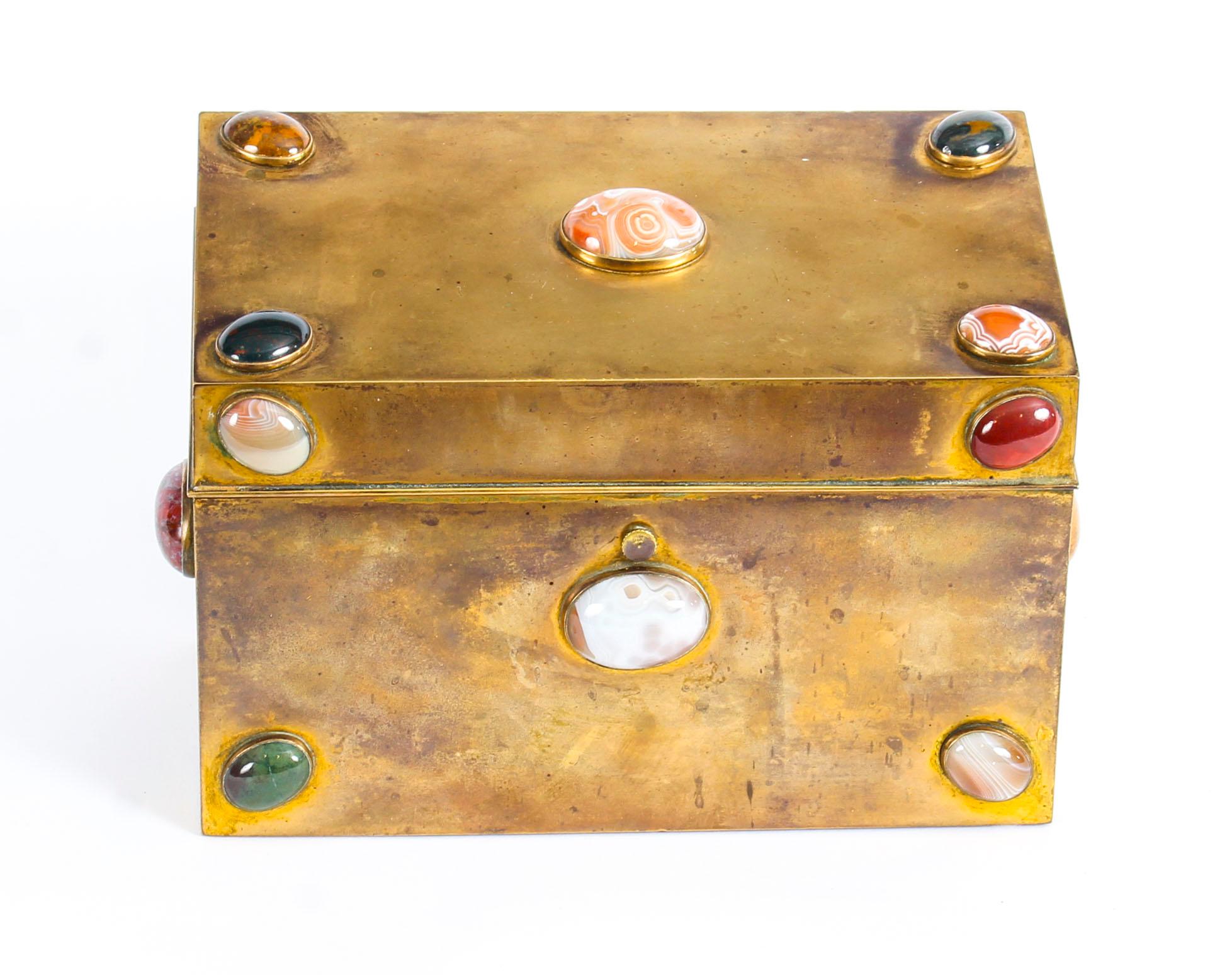 This is a superb quality Victorian brass stationery casket, circa 1860 in date.

This wonderful stationery casket is rectangular in shape and features twelve distinctive applied polished semi-precious stones - including agate, jasper, and