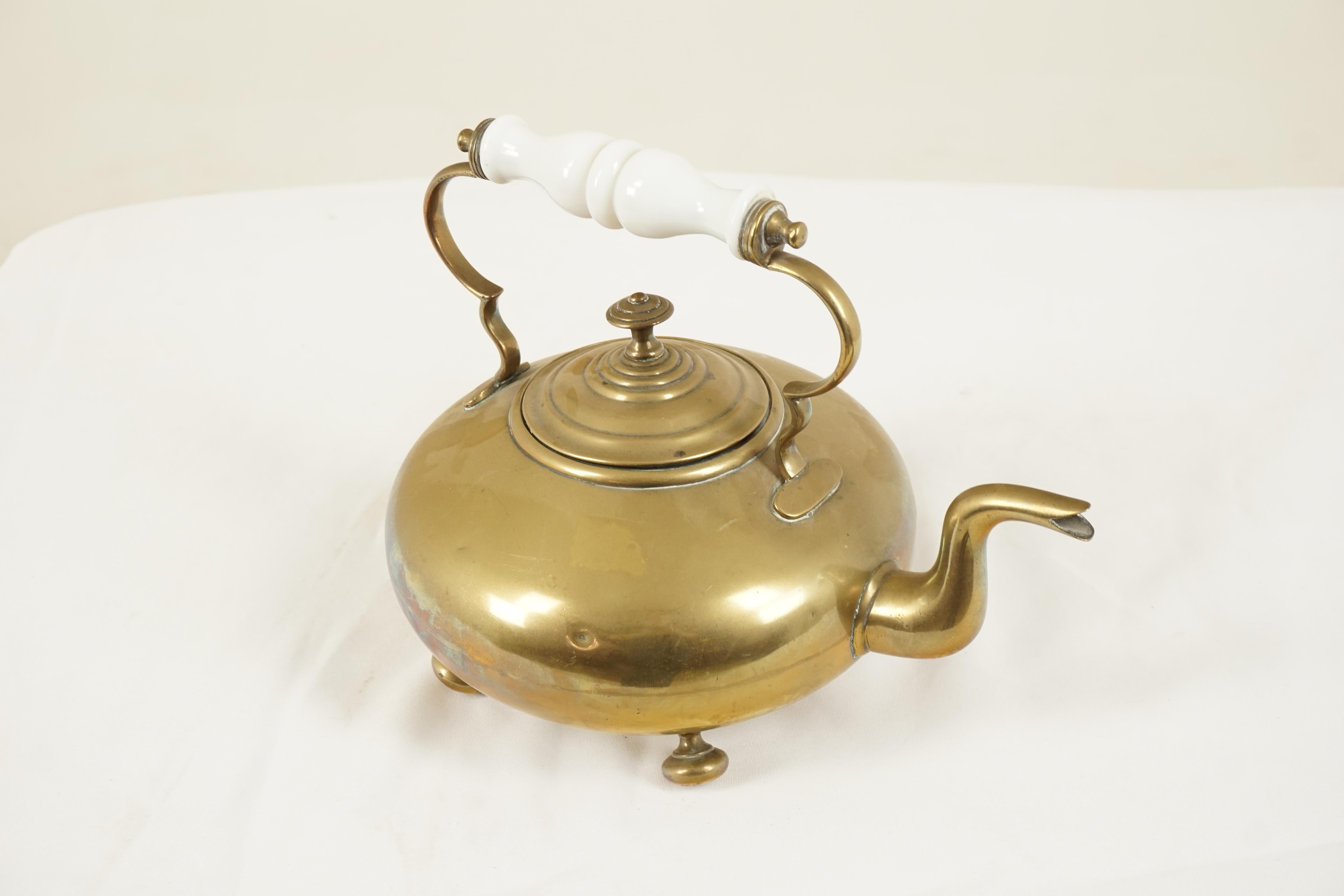 Antique Victorian brass toddy kettle, milk glass handle, Scotland 1880, B74y

Scotland 1880
Solid brass
Elegant shaped milk glass handle
Circular body and classic spout
Inside kettle has a tin lining
The kettle stands on four turned brass
