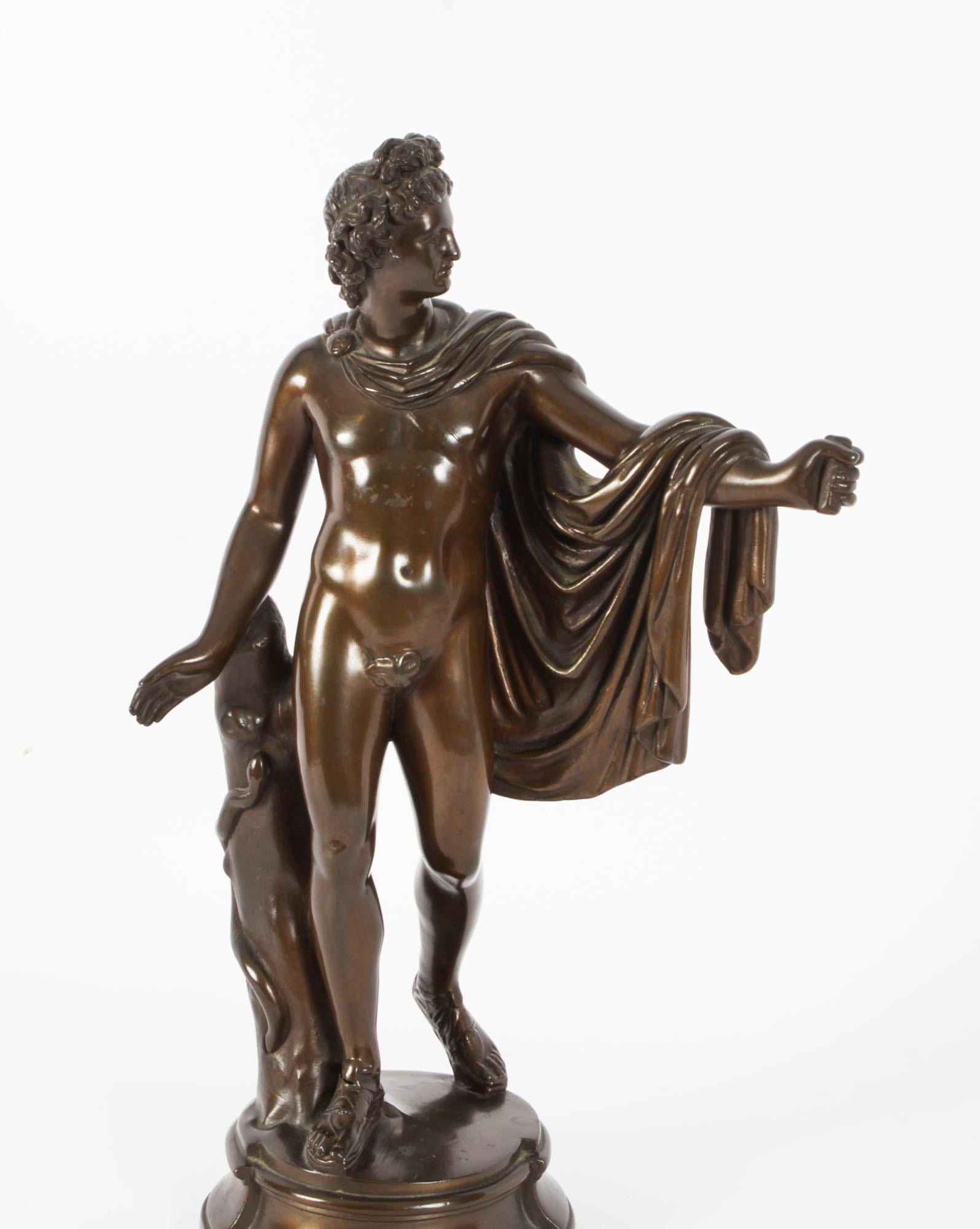 This is a truly magnificent antique Victorian patinated bronze sculpture of the famous Greek God Apollo, modelled upon a shaped circular socle, inscribed monogram 'NF' and numbered 21170 to the underside, circa 1860 in date.
 
This stunning bronze