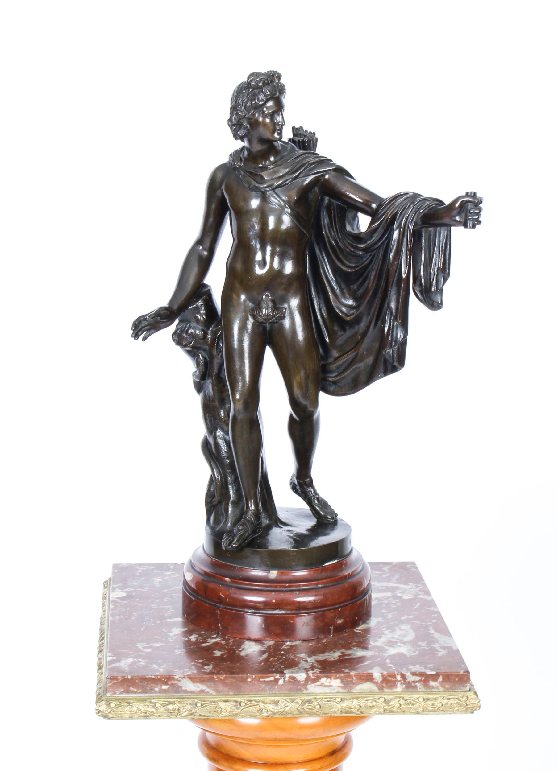 huge bronze statue of the god apollo