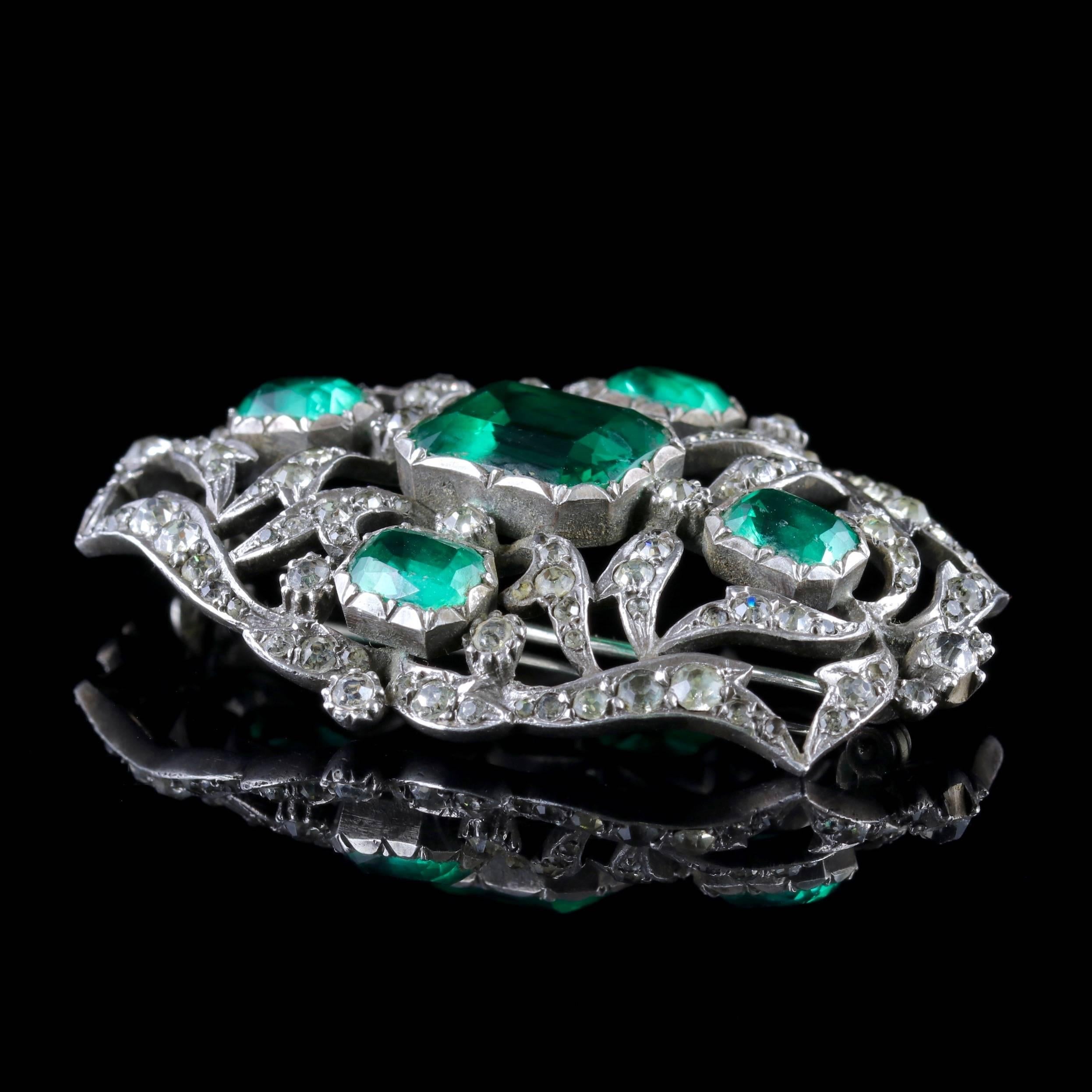 To read more please click continue reading below-

This fabulous Silver antique green Paste Stone brooch is Victorian Circa 1890.

The wonderful brooch is decorated in sparkling white Paste Stones with four fabulous green Pastes that simulate