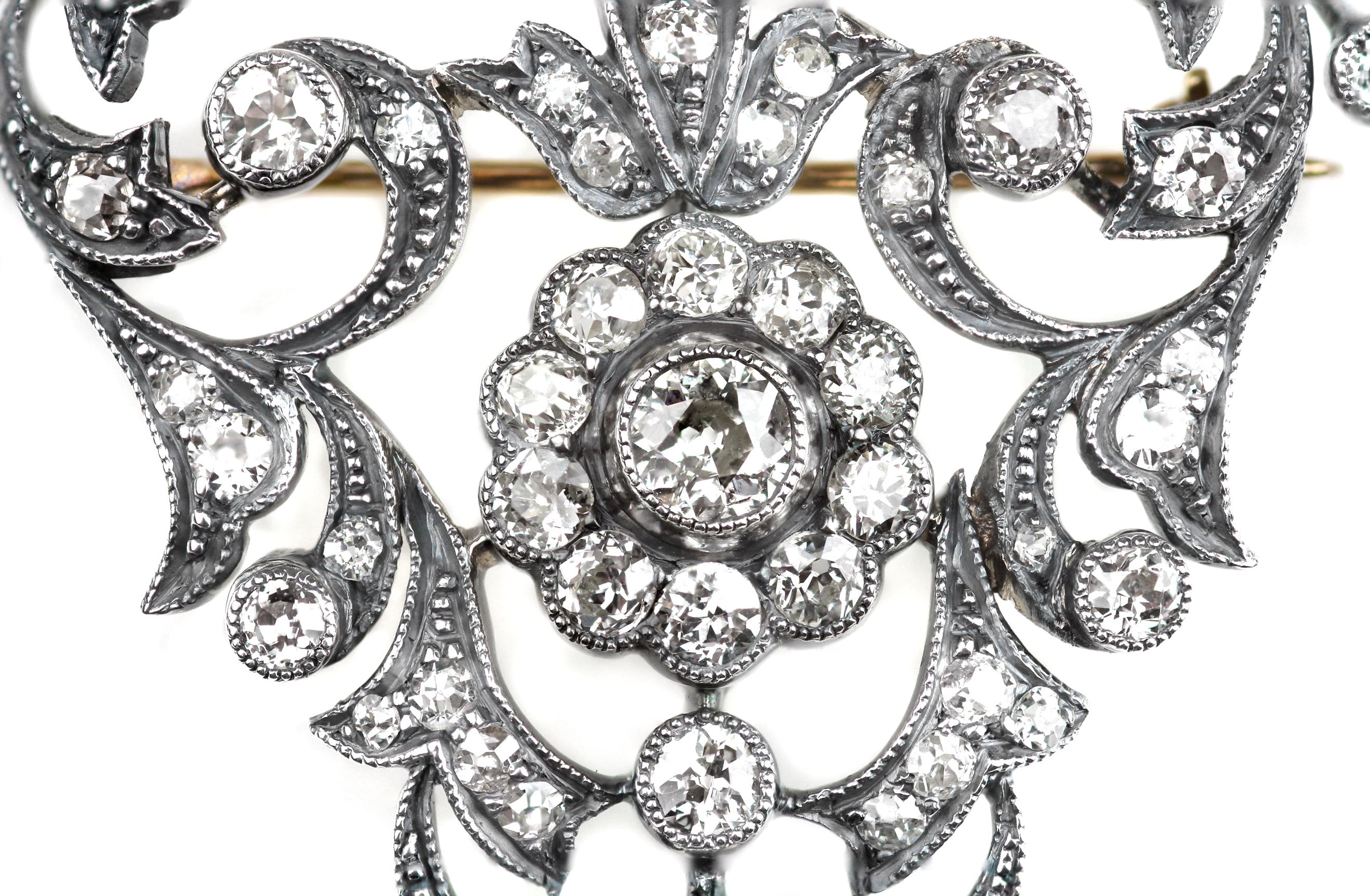 Antique Victorian filigree brooch with old European cut diamonds set in silver and gold. This brooch is a fine example of Victorian elegance and the jewellers art.
67 x old cut diamonds, approximate total weight 3.0 carats, assessed colour I/J,