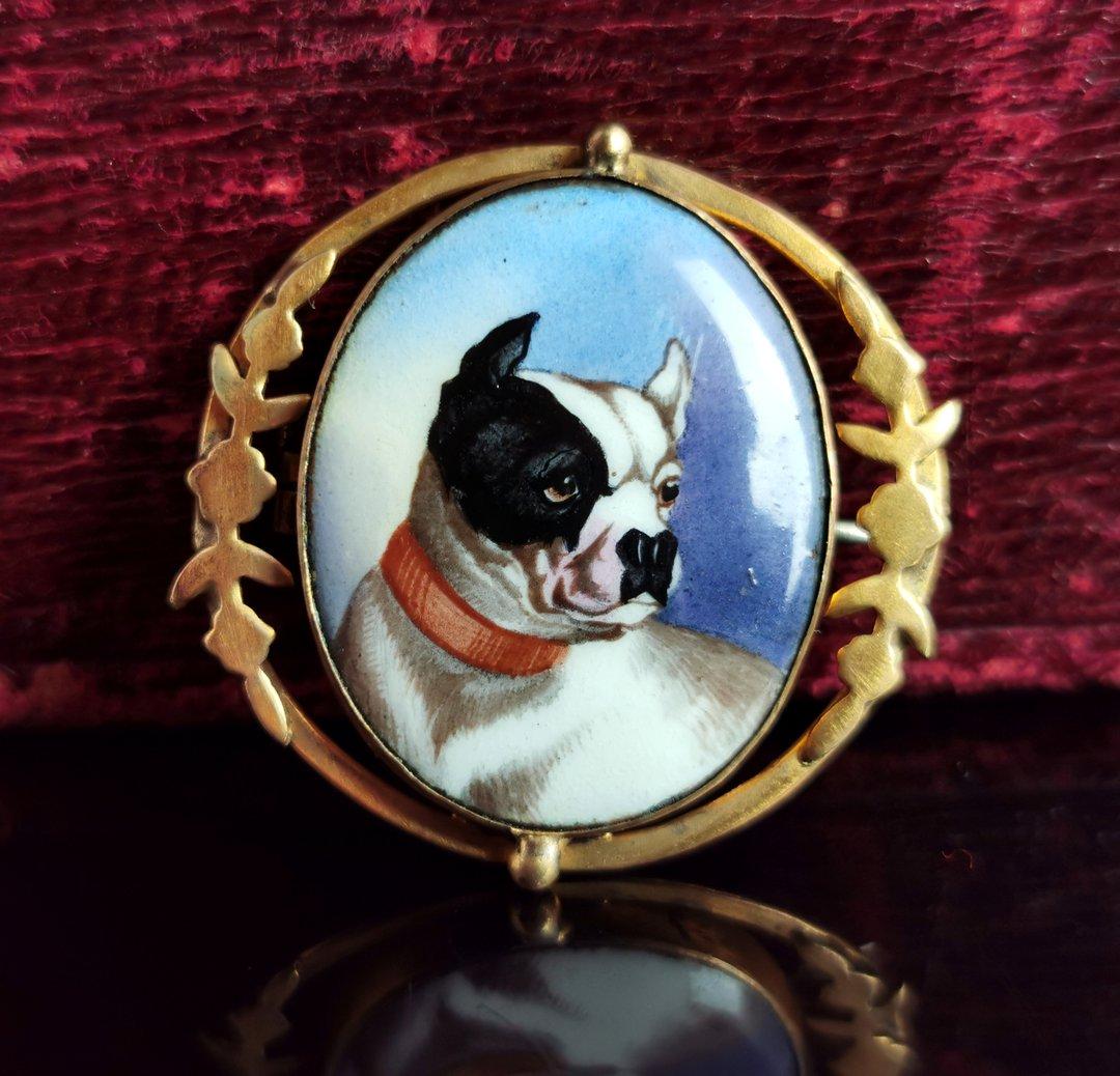 A fine and rare antique, Victorian era enamelled bulldog brooch.

This beautiful piece has been very finely hand enamelled with a sweet portrait of a bulldog, obviously a very beloved dog, the portrait is of a high quality.

The portrait sits in an