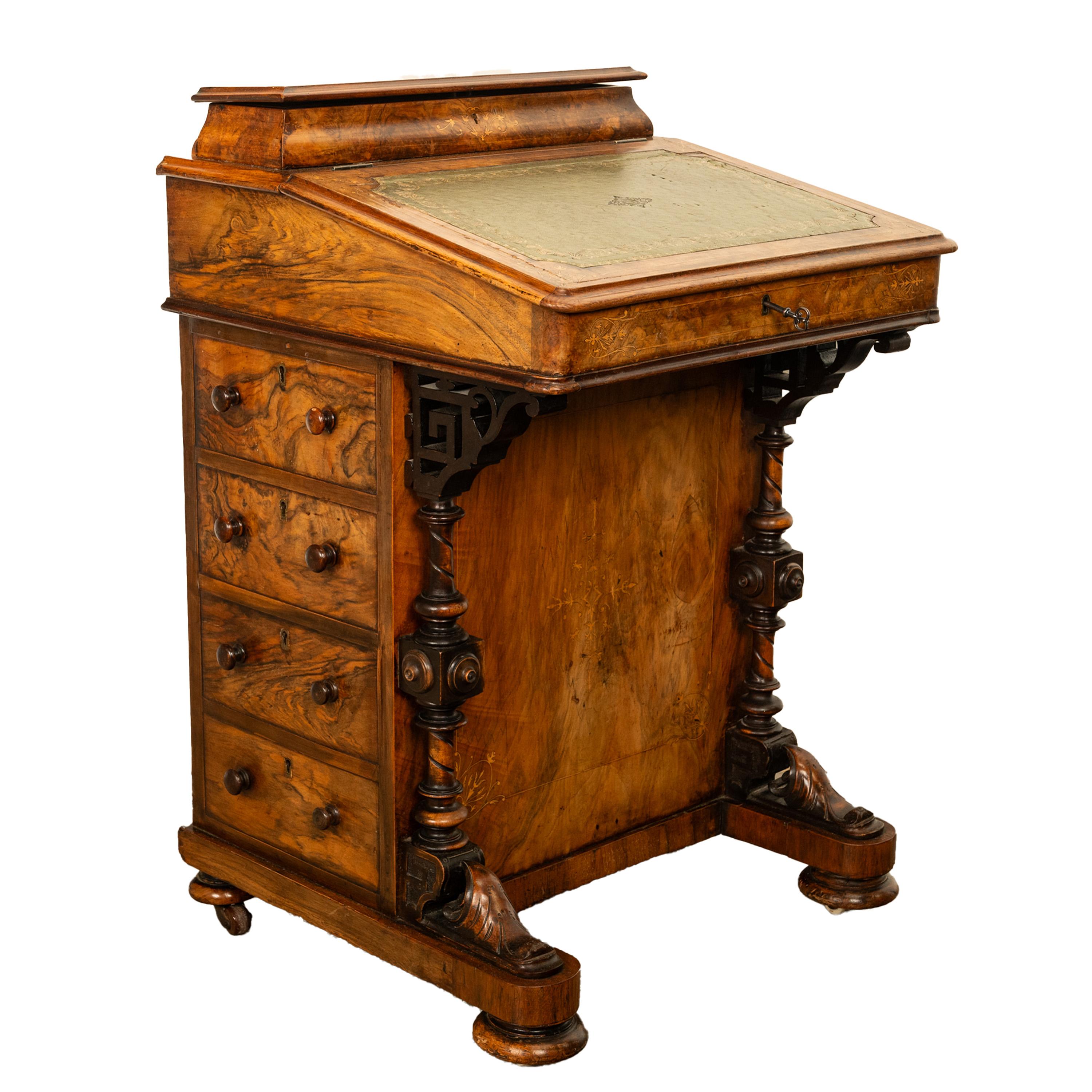 A fine antique burl walnut & inlaid marquetry Davenport desk, circa 1860.
The davenport is made from the finest figured burl walnut, to the top is a lift up lid with a fitted interior for pens and other writing materials.
Below is a lift up