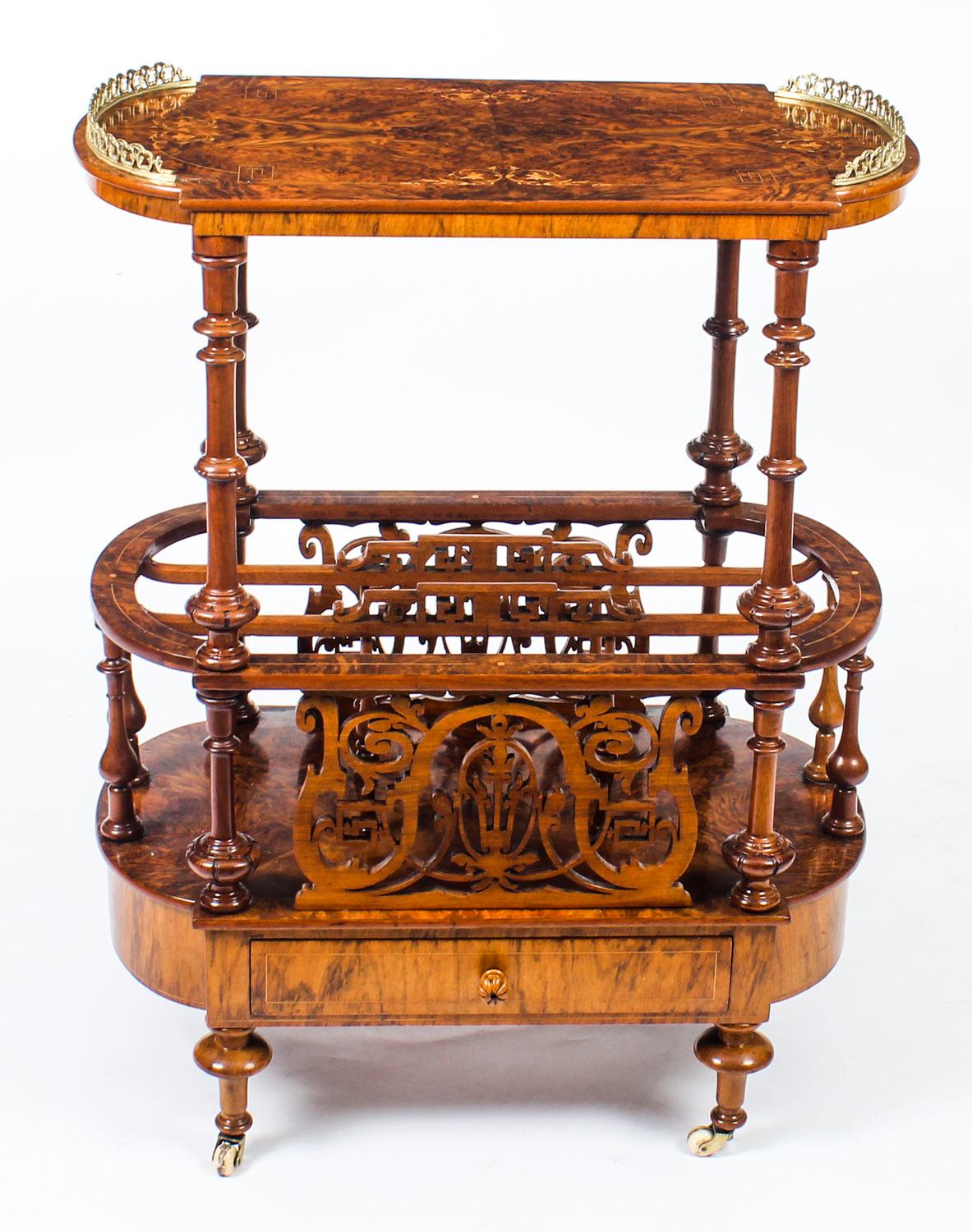 This is a gorgeous antique Victorian burr walnut and marquetry Canterbury circa 1870 in date. 

The grain of the burr walnut and the inlaid marquetry are truly beautiful, the solid walnut fret carved sides and dividers are a masterpiece of the